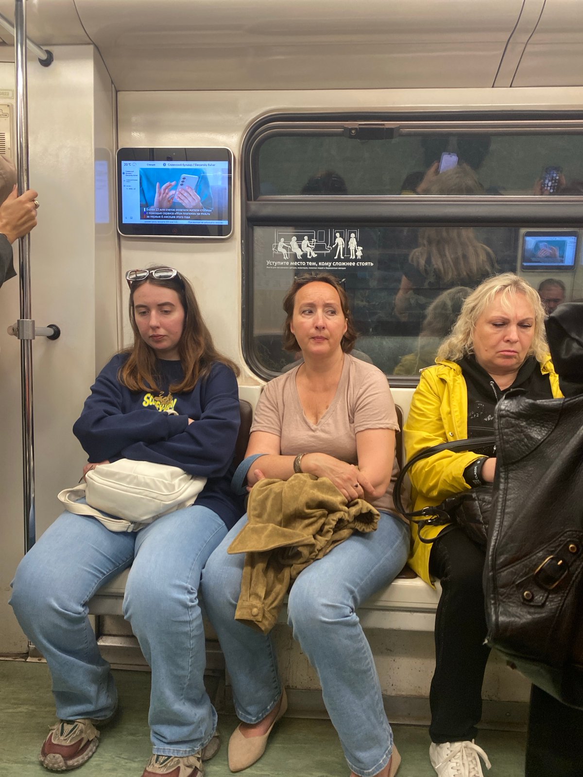 Everyday moments aboard the Moscow Metro on a July afternoon