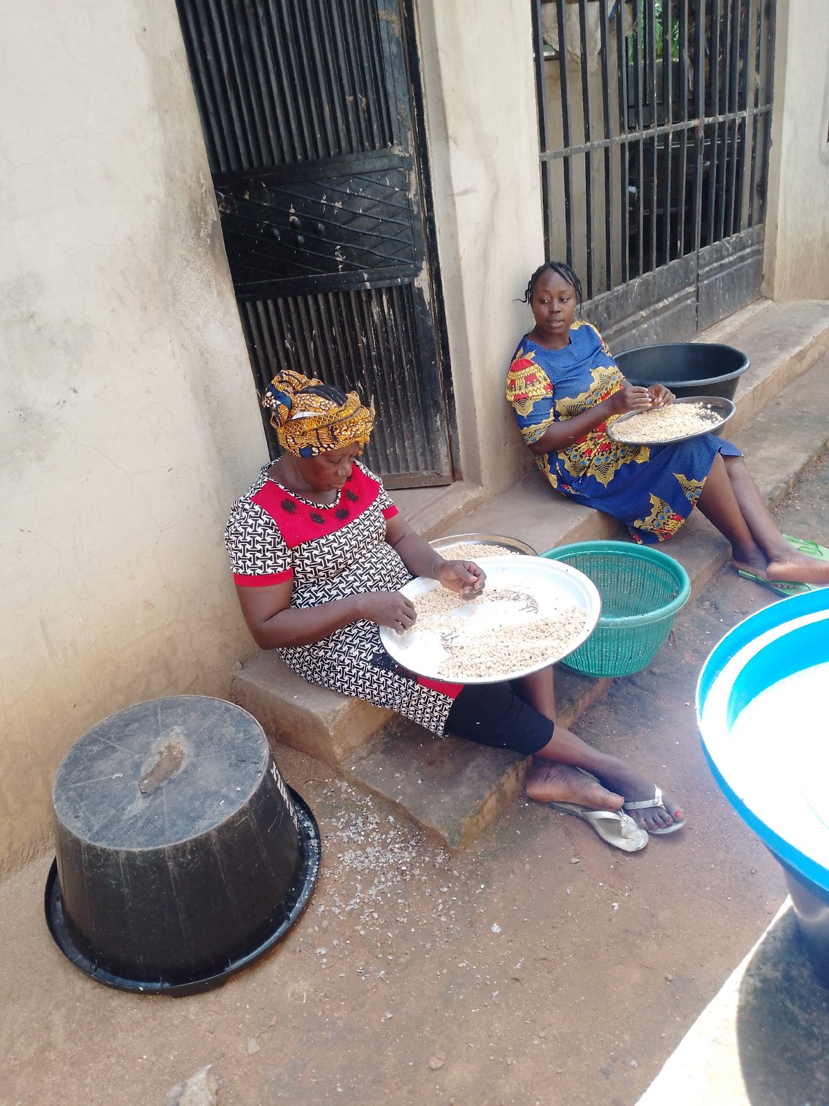 Community gathering, possible polling activity, everyday street scenes