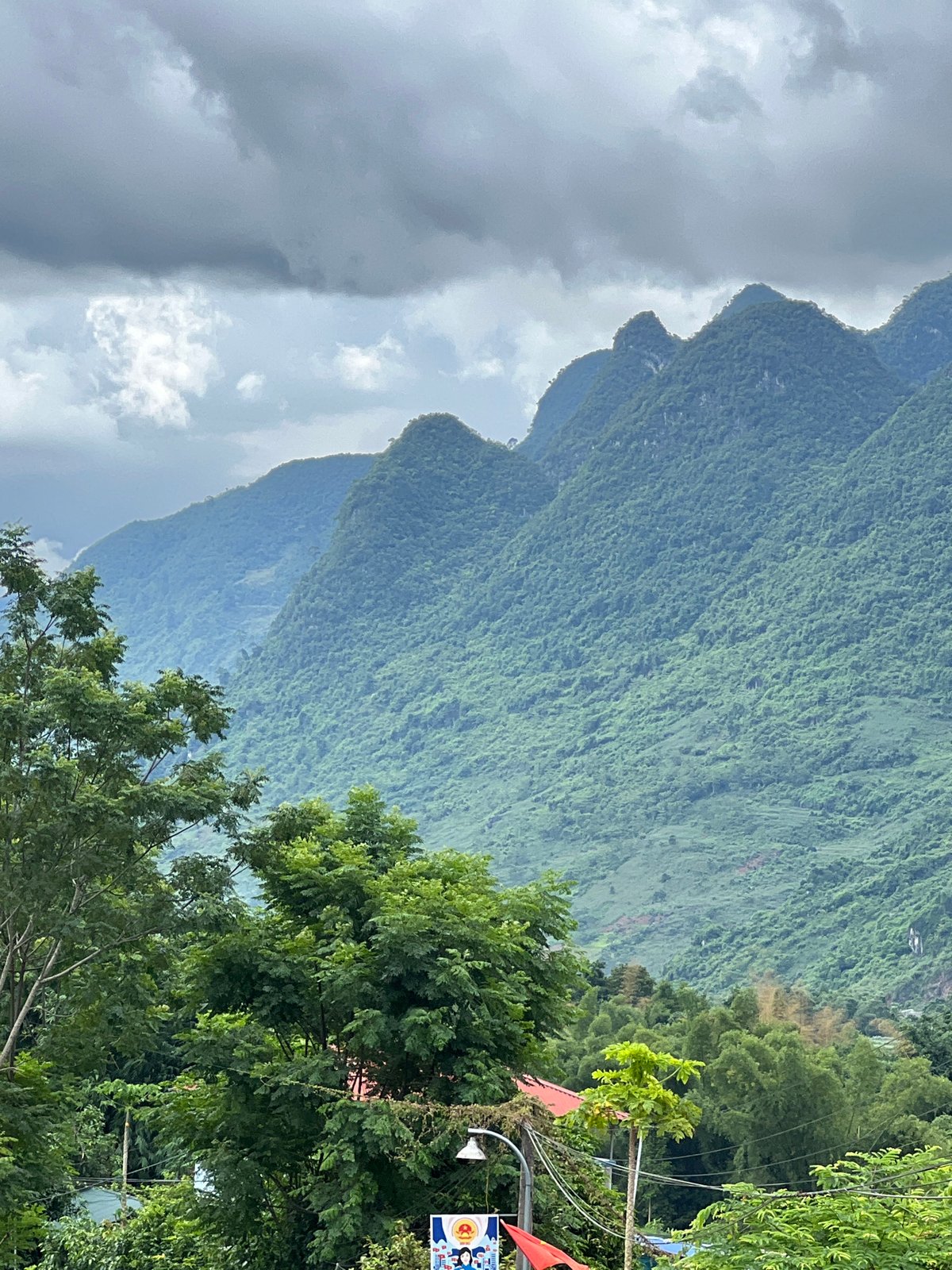 Rural mountain scenery along a winding road in Lũng Tám, Vietnam