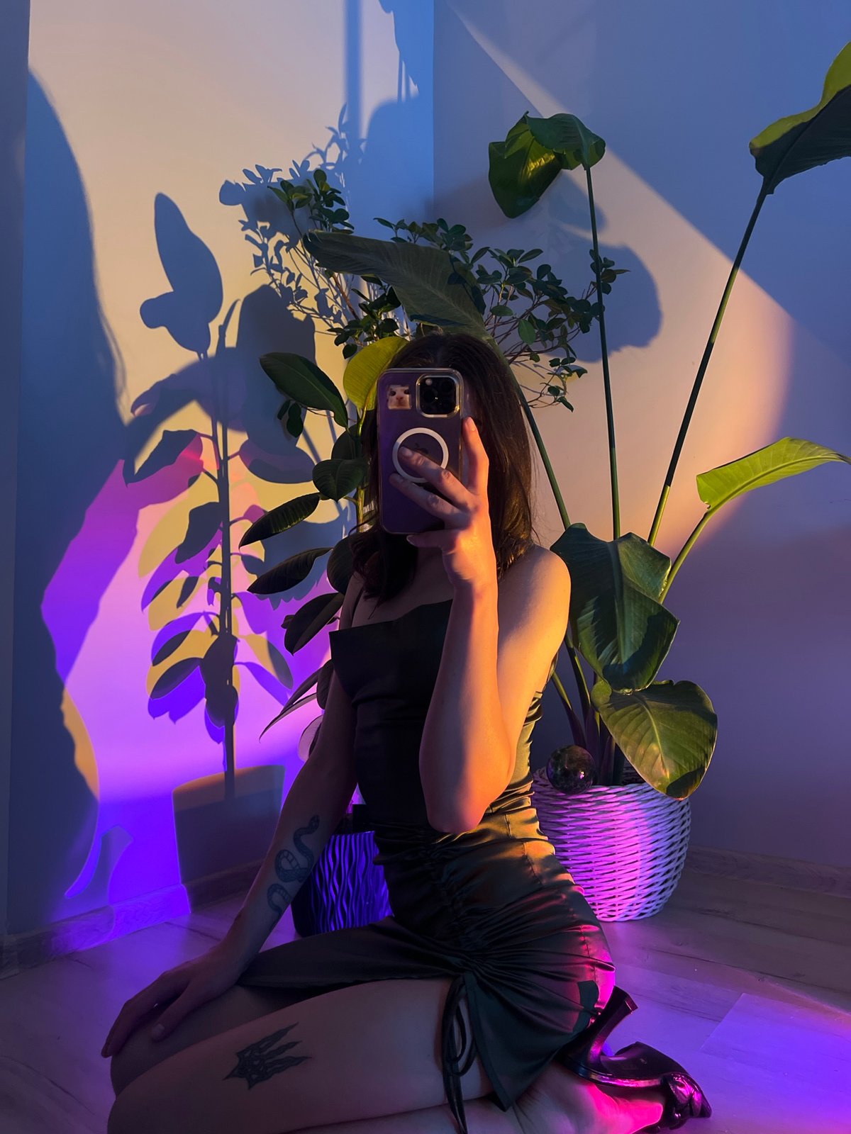 Selfie session in a purple-lit plant-filled room, Ternopil