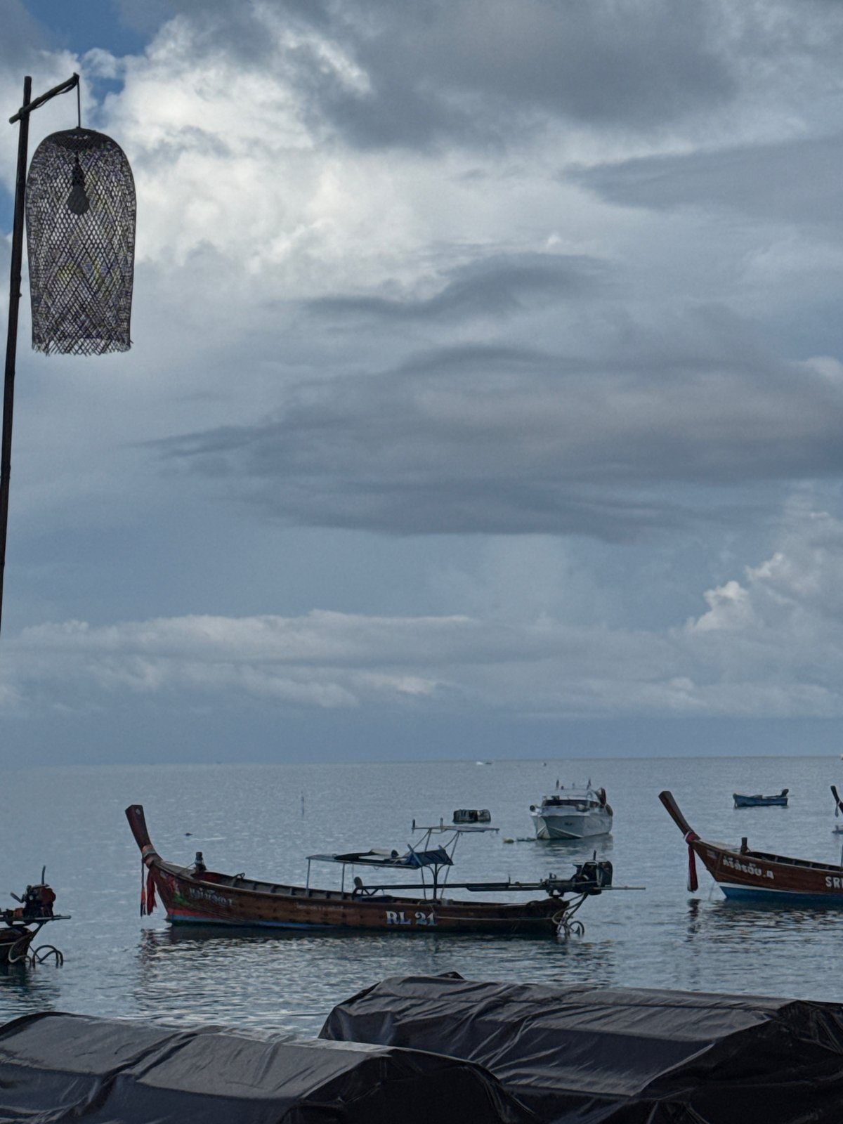 Rawai waterfront scenes with boats, runner, and Thai coastal life