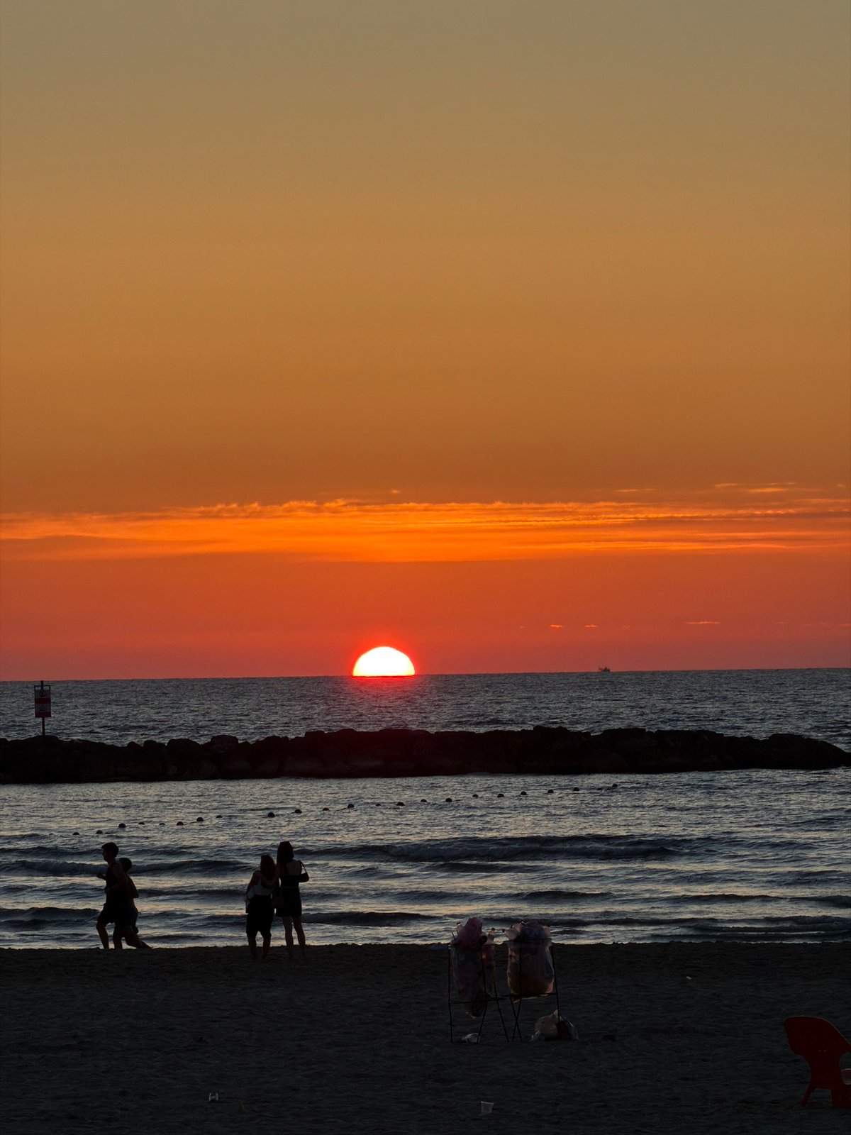 Sunset draws crowds to Tel Aviv beach Friday evening
