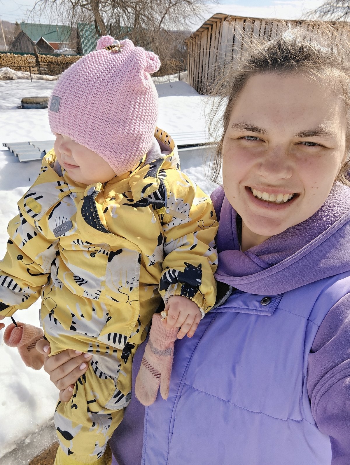 Family life documented in Russian village during spring morning