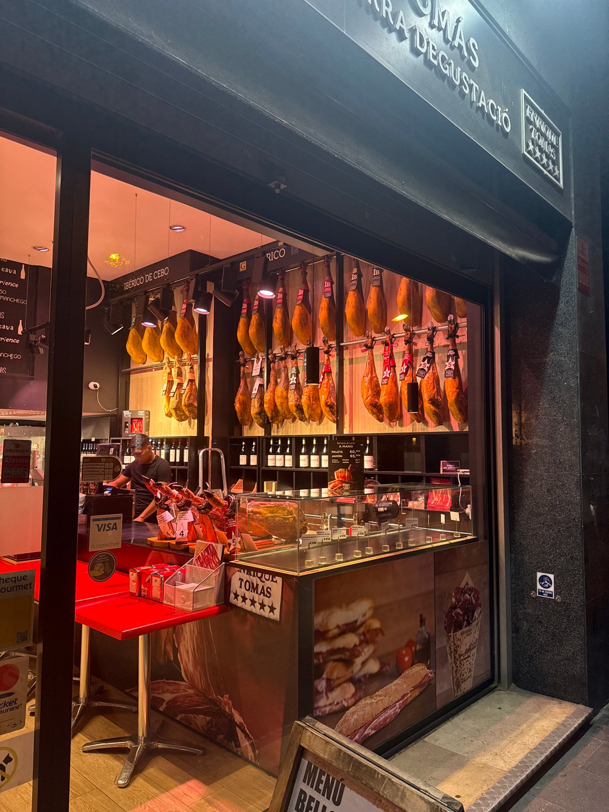 Barcelona neighborhood at dusk, local streets and storefronts