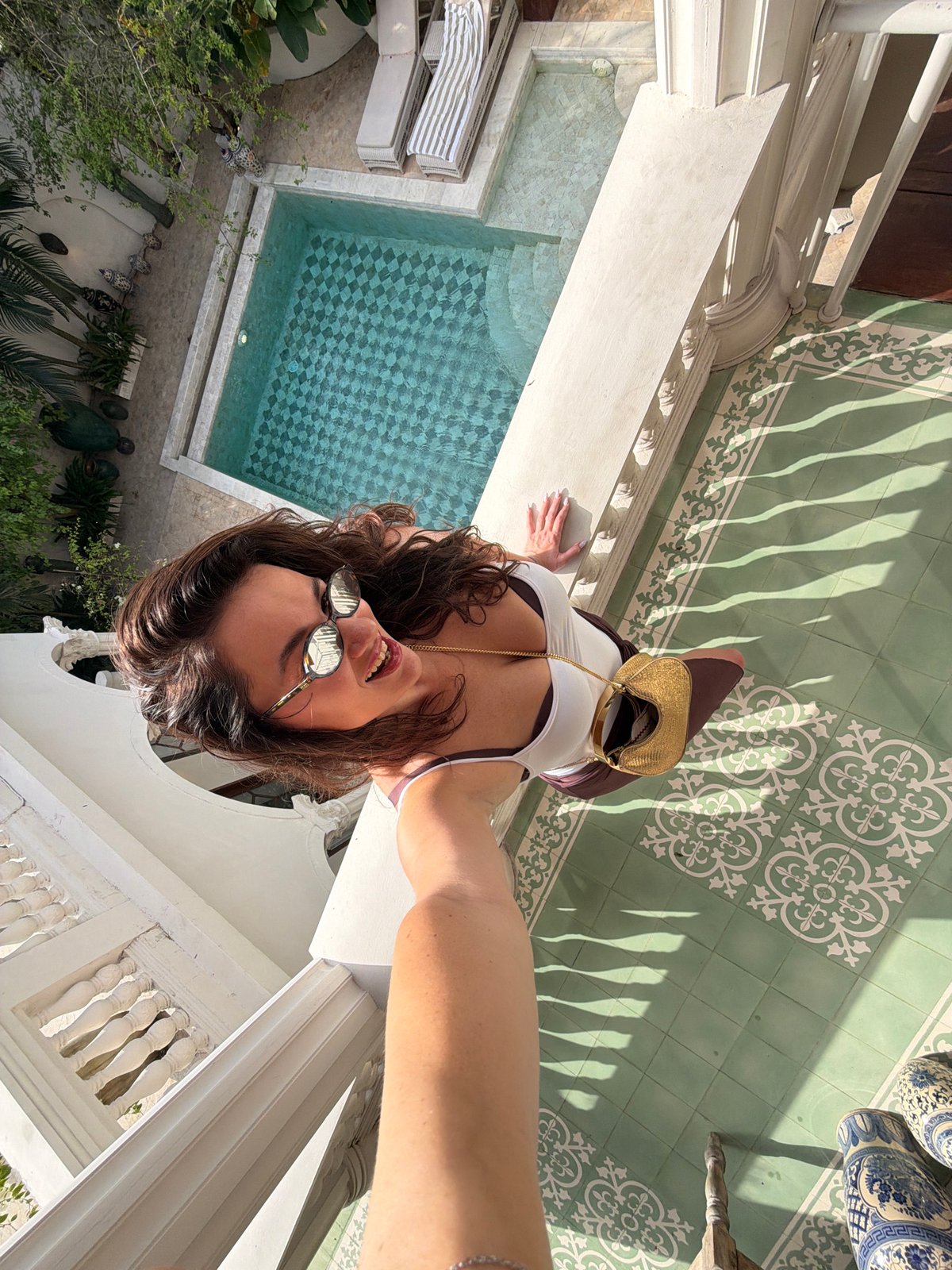 Woman takes selfies from elevated spot in North Kuta