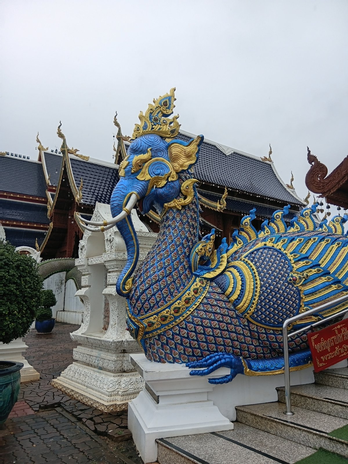 Close look at Wat Ban Den's ornate mythical sculptures and temple facade