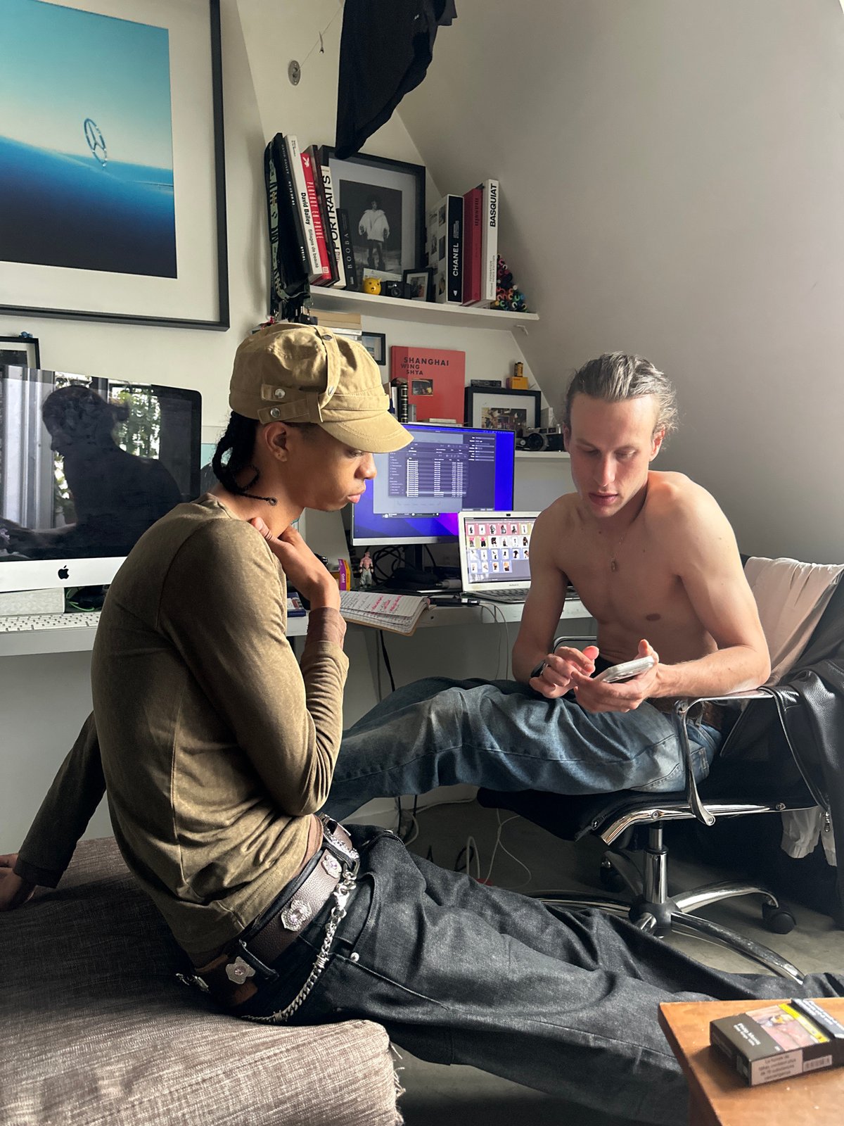 Two people interact casually in Paris apartment during afternoon