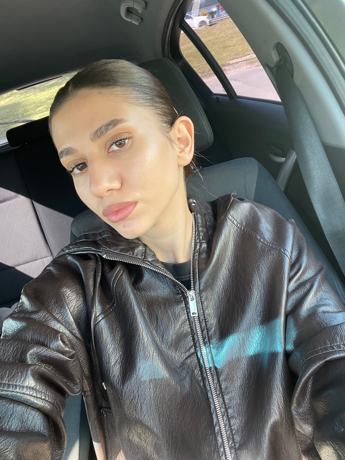 Woman in leather jacket observed in car in Sofia