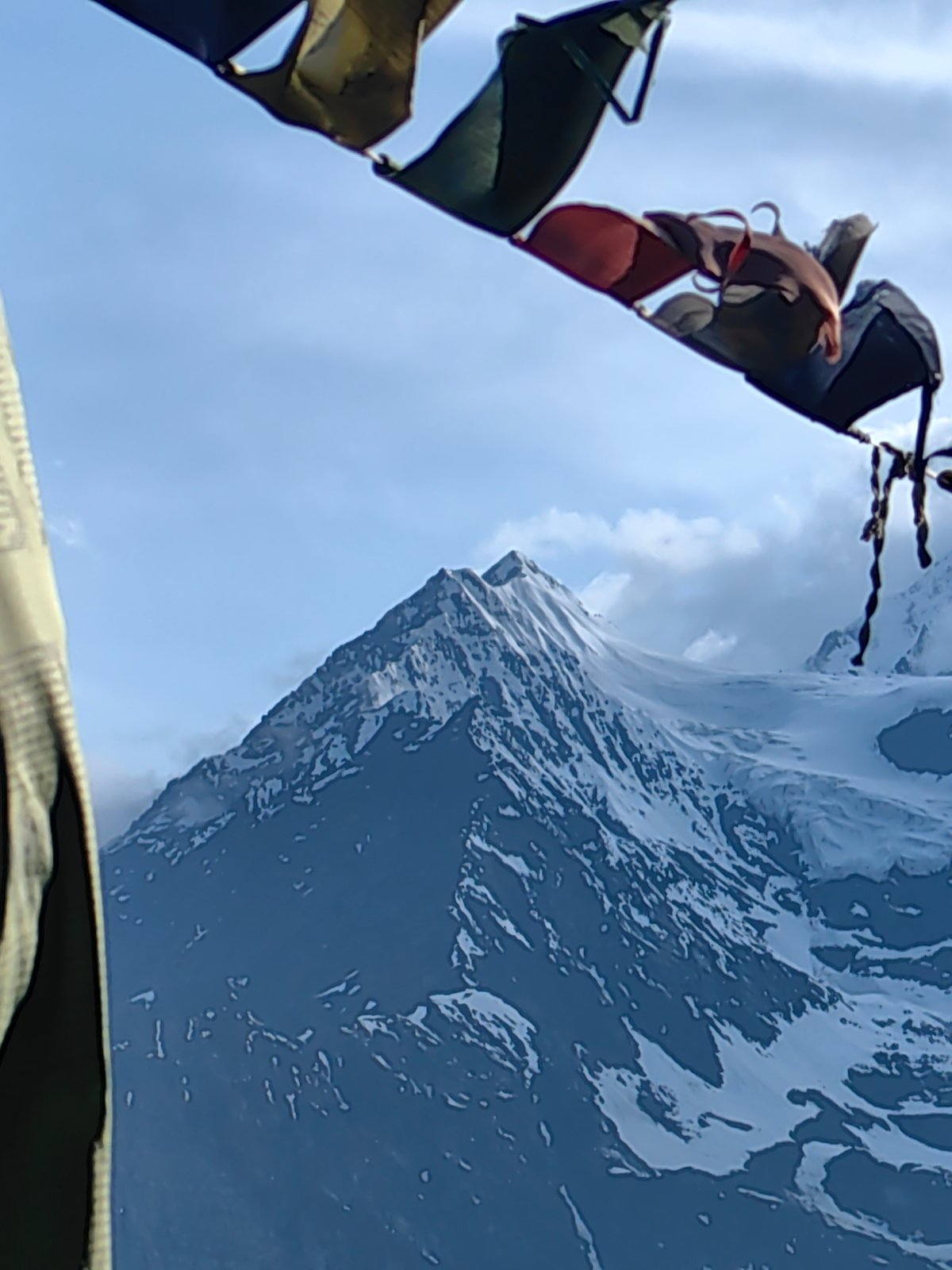Prayer flags and Himalayan peaks in Keylang, summer solstice