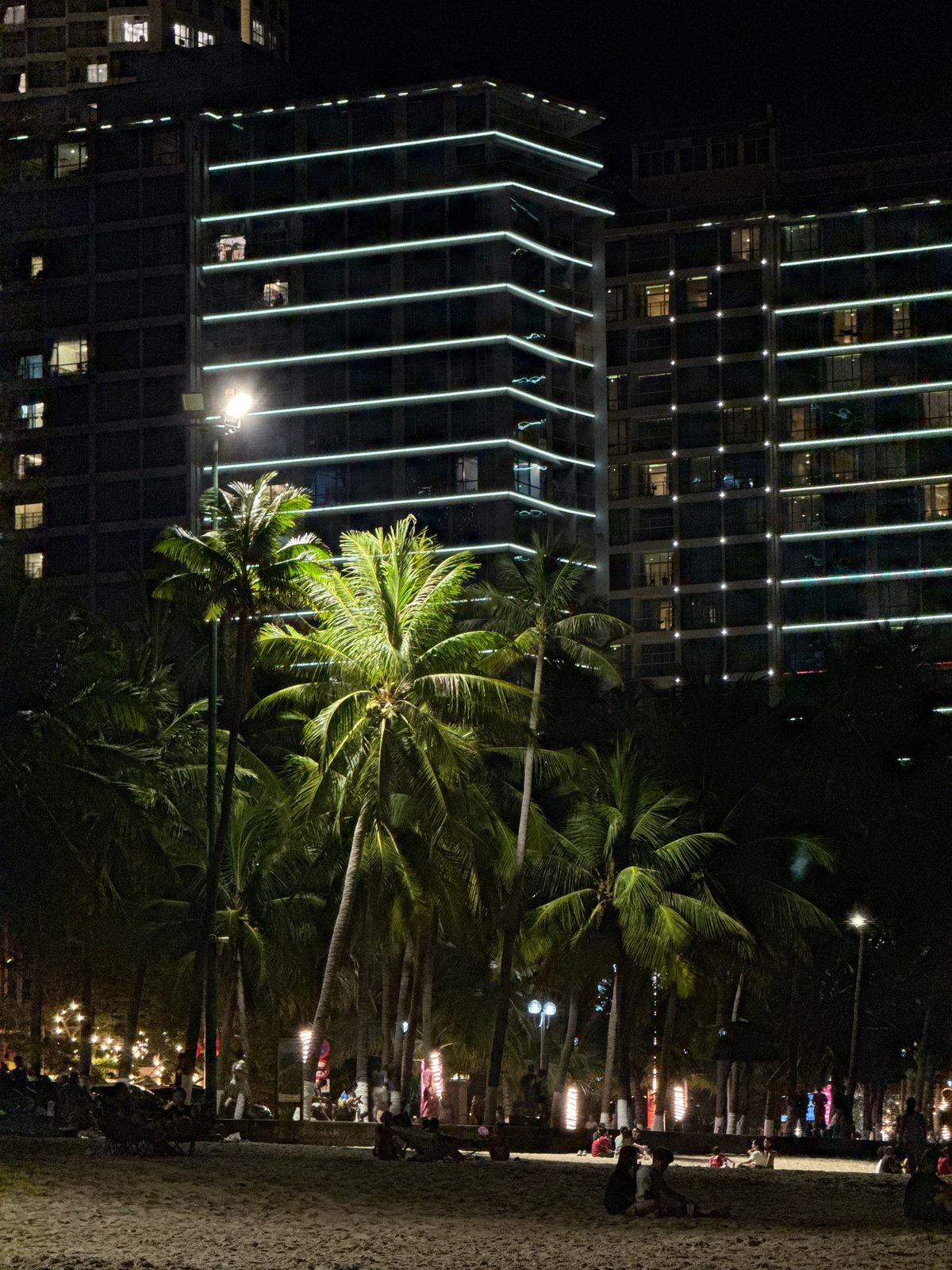 Nha Trang scenes: beachfront crowds and market figurines captured
