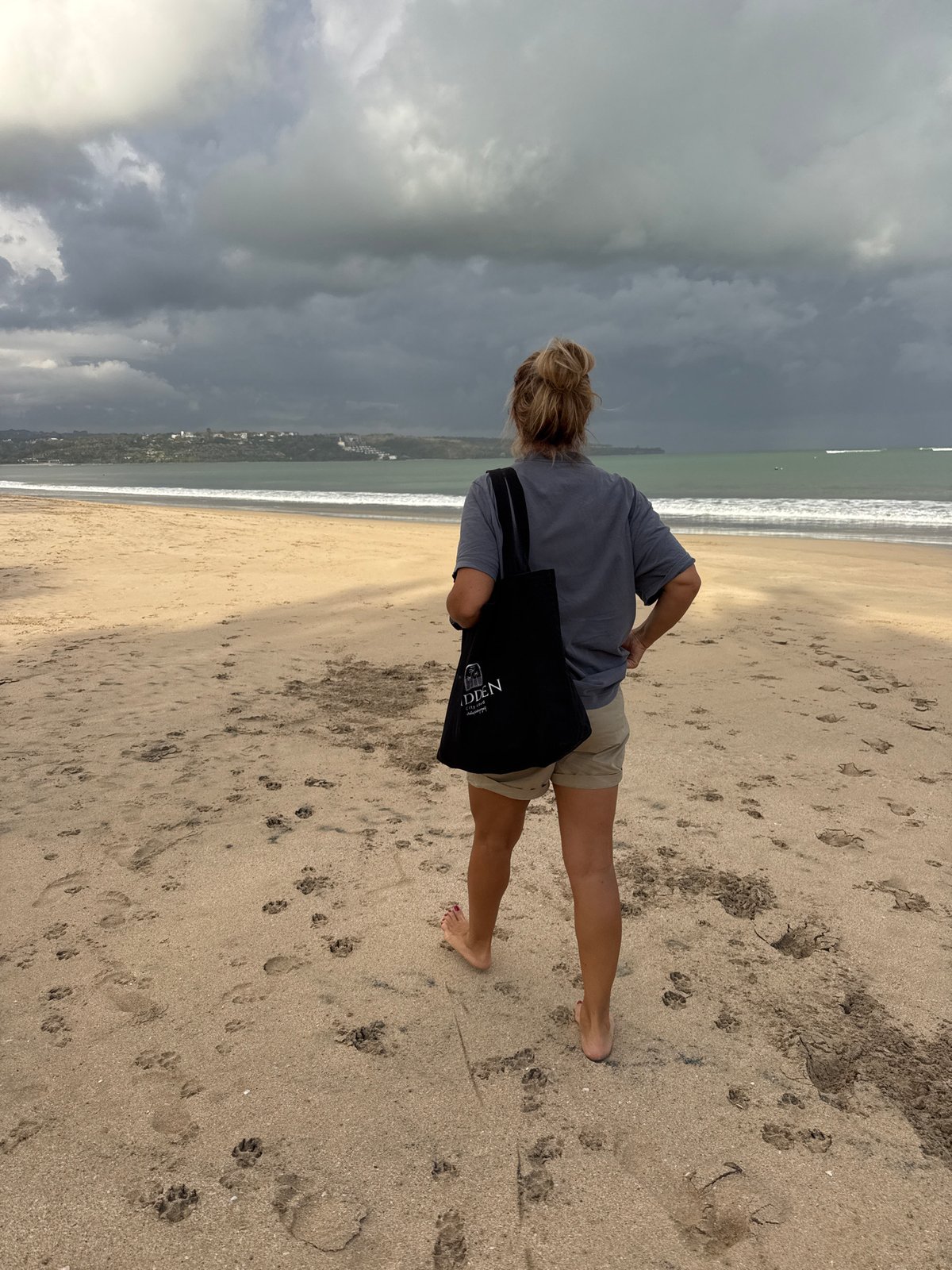 Jumping and posing on a moody Kuta Beach afternoon