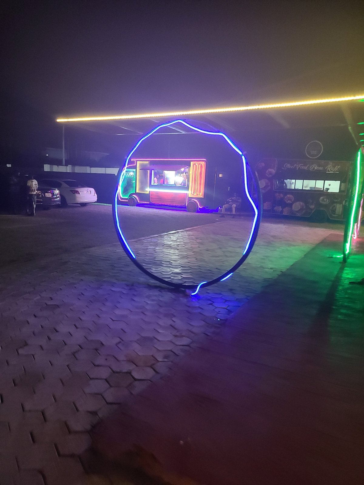 Neon-lit food trucks draw evening crowds in Jos, Nigeria