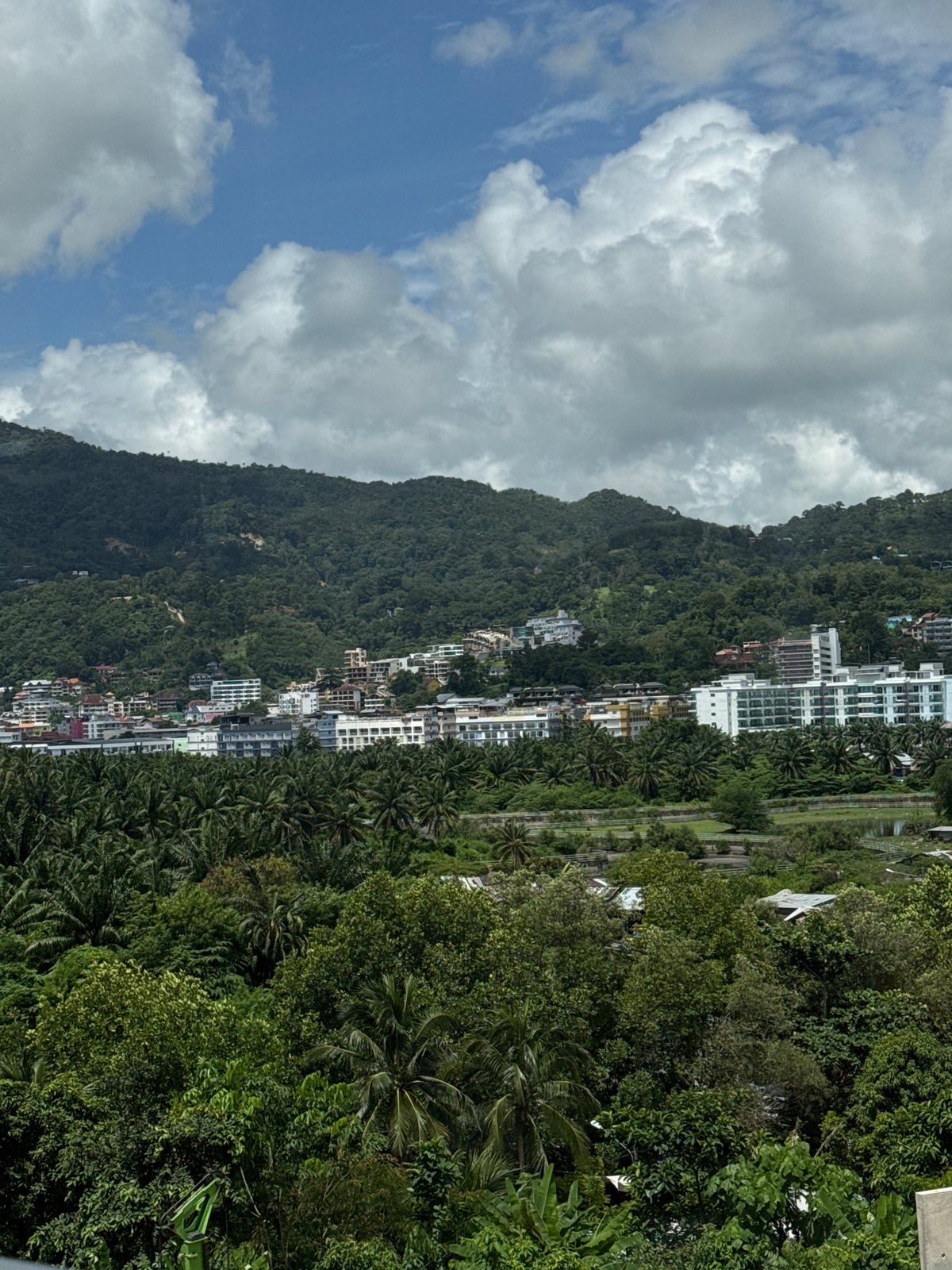 Breakfast views over Patong, with construction dotting the hills below