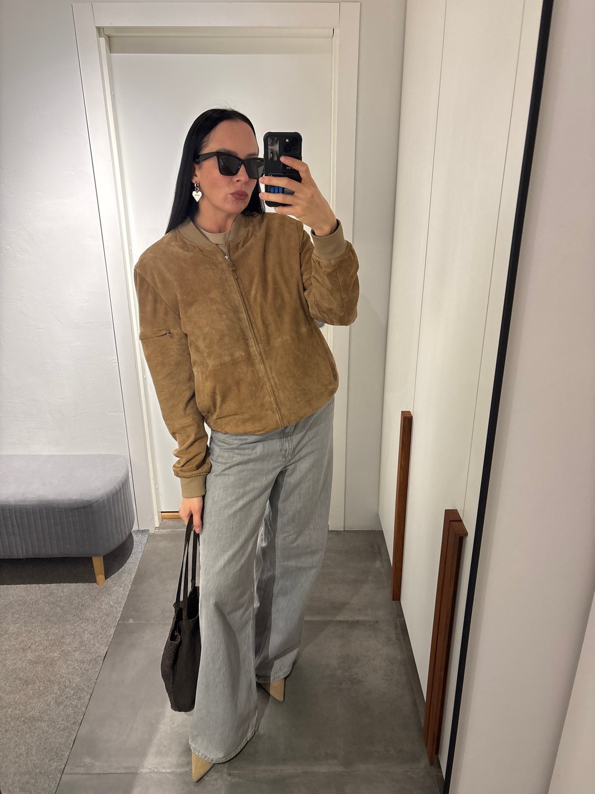 Woman takes selfies in dressing room in Chaikovsky