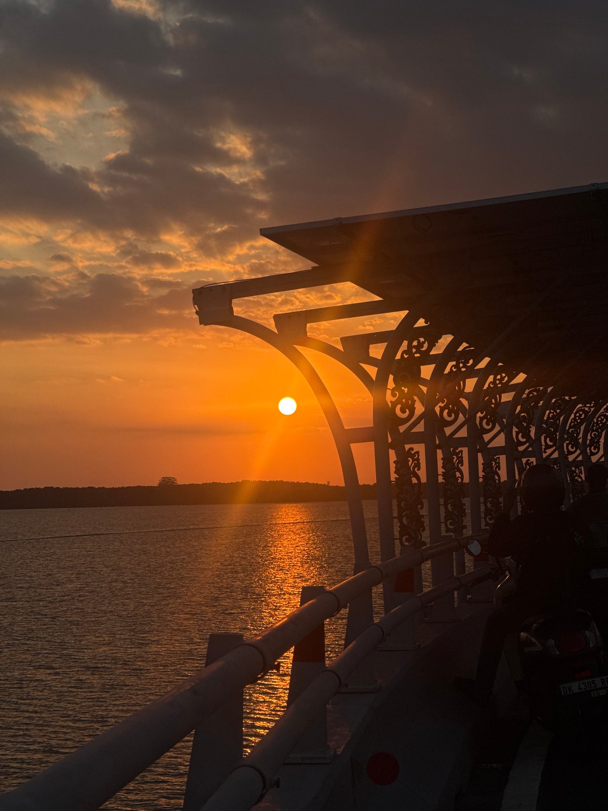 Sunset observed from bridge walkway in Kuta Selatan, Indonesia