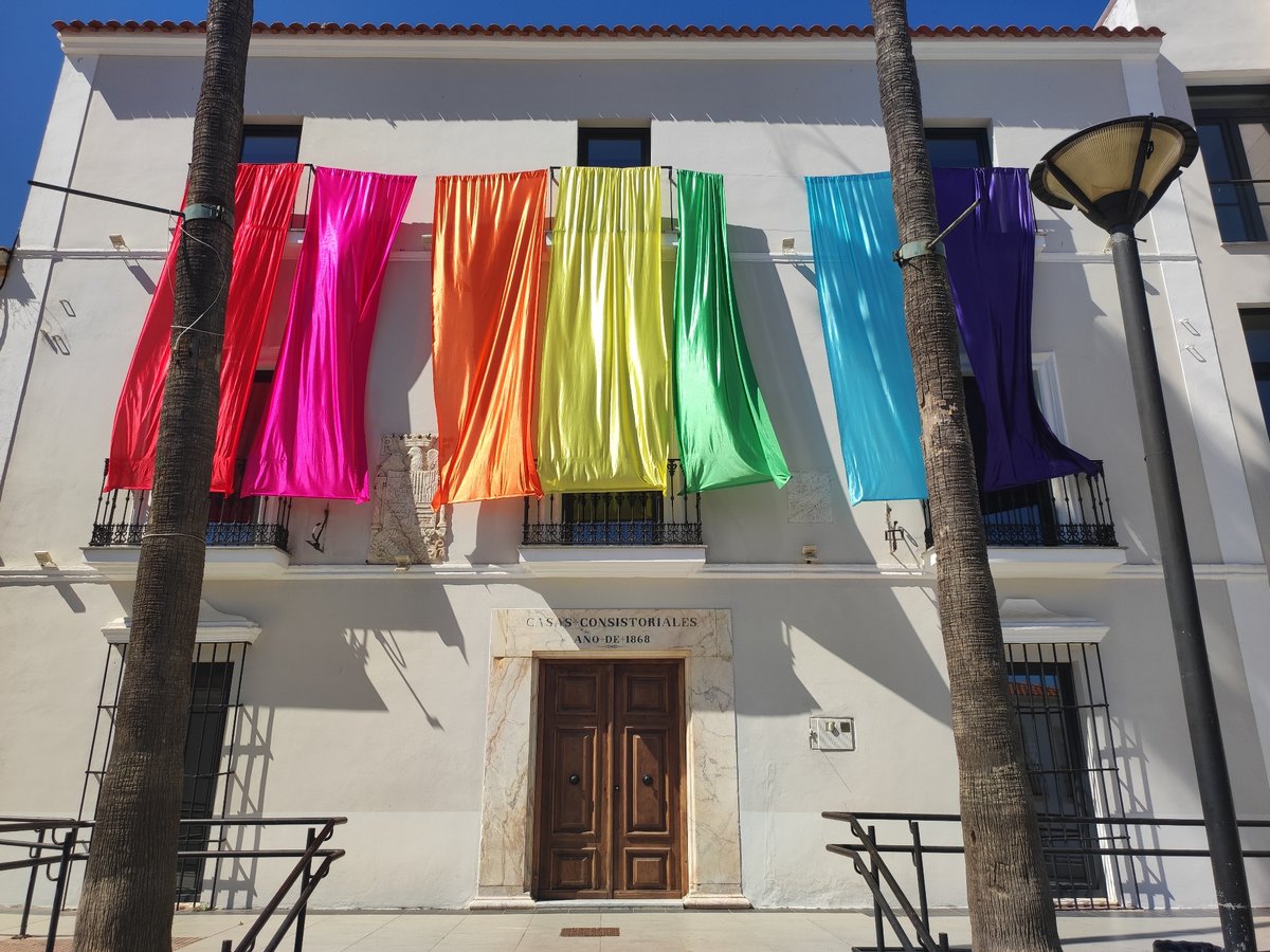 Rainbow banners and street life fill Valverde de Leganés plaza