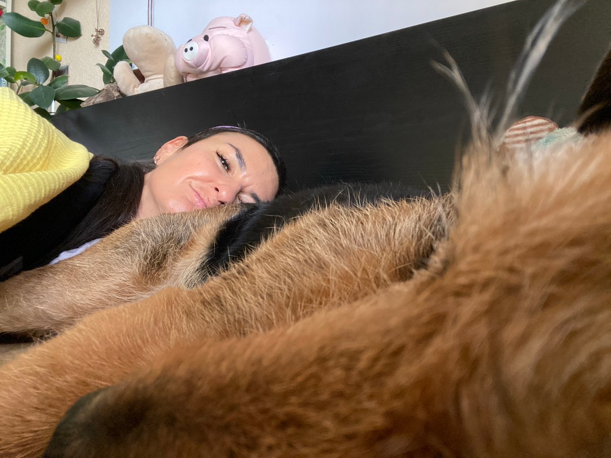 Woman and brown dog share quiet moments in Moscow