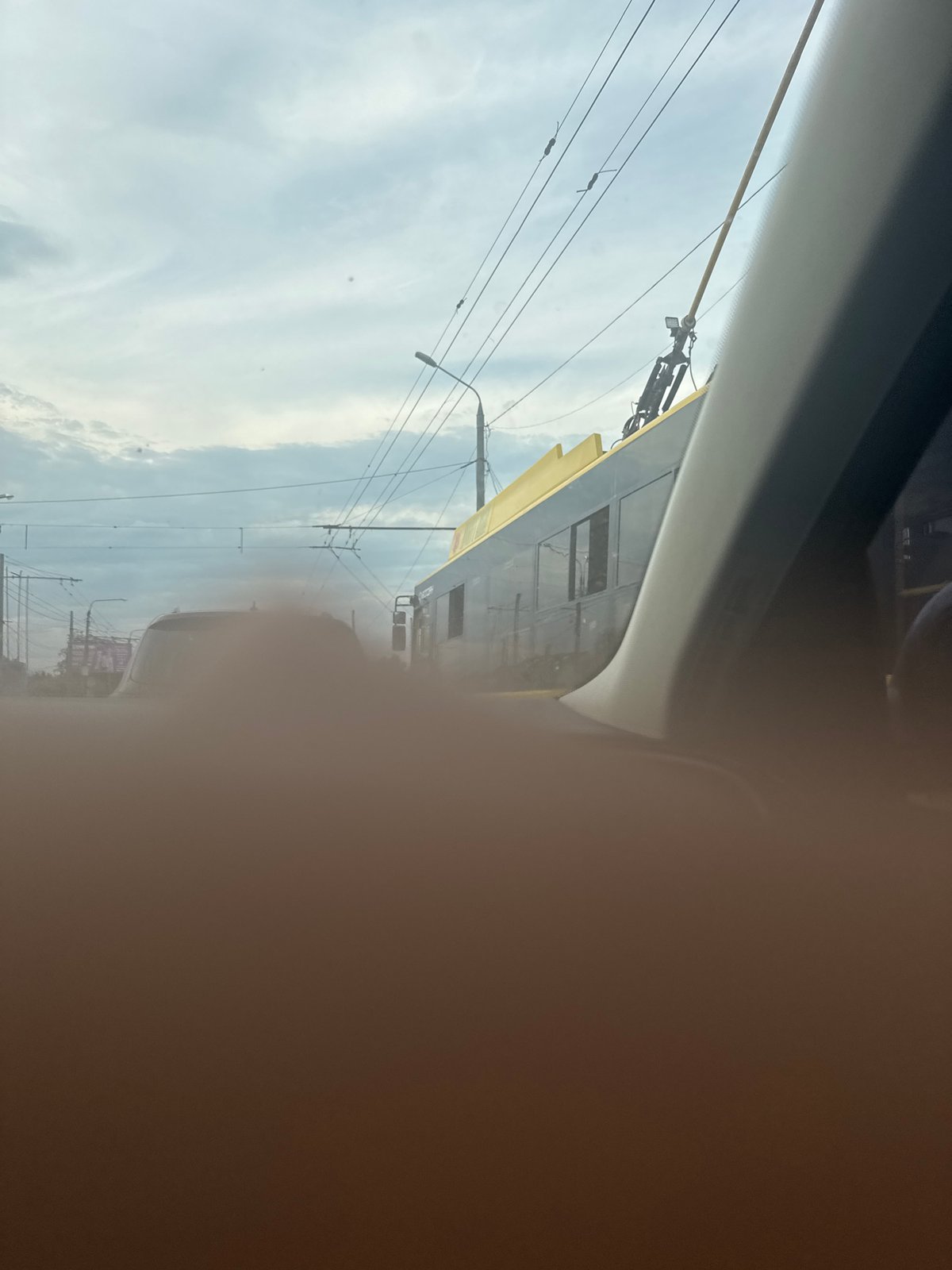 Driver Documents Street View Through Passenger Window, Finger Blocks Lens
