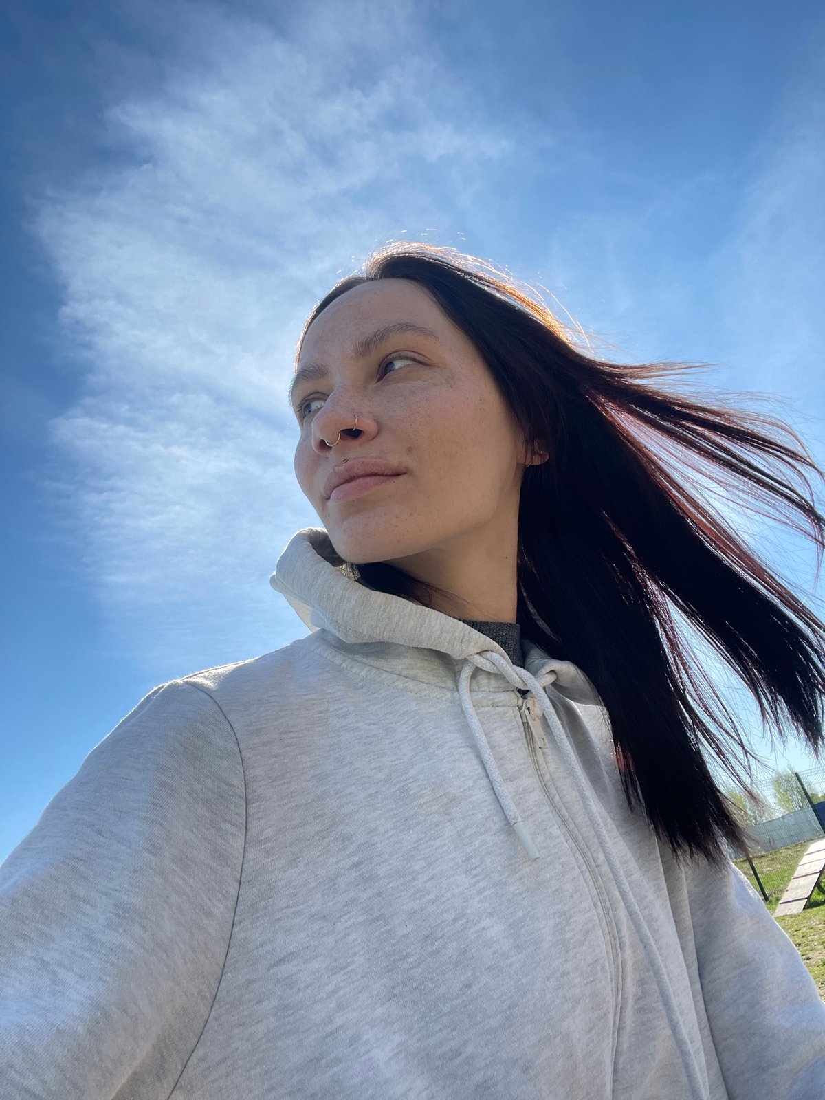 Person photographed against blue sky in Pervomaysky, Russia
