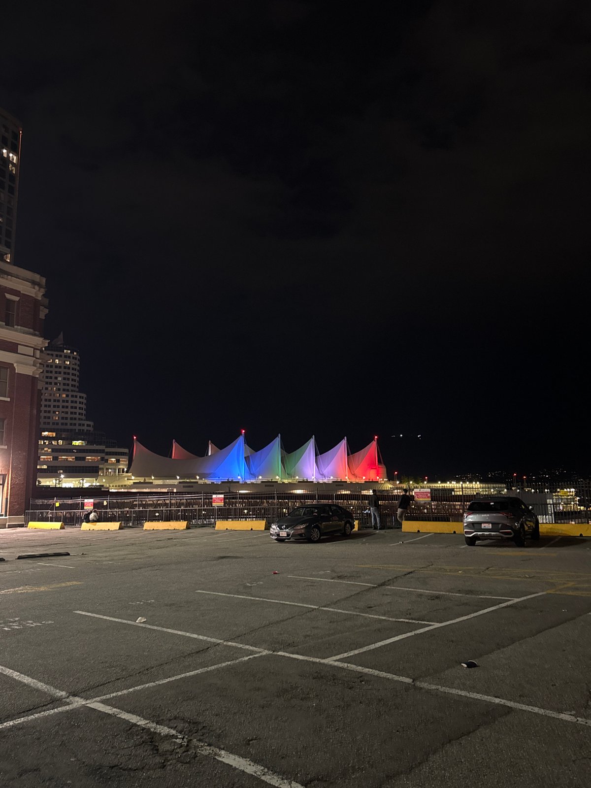 Nighttime walk documents Vancouver's illuminated downtown and active container port