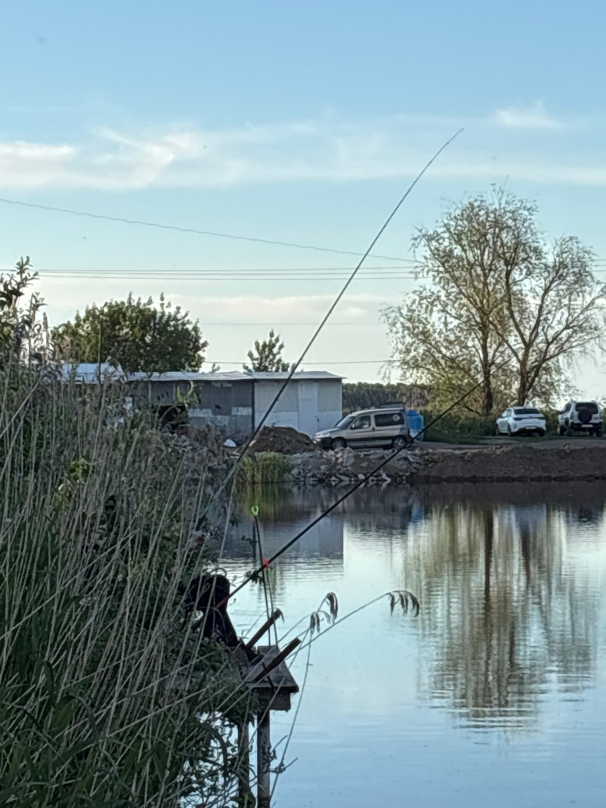 Afternoon fishing session documented at Khryashchevka lake dock