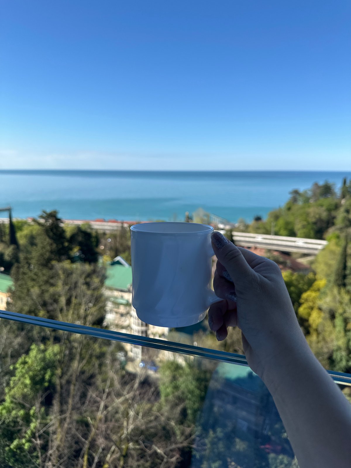 Morning coffee moment captured along Sochi coastline