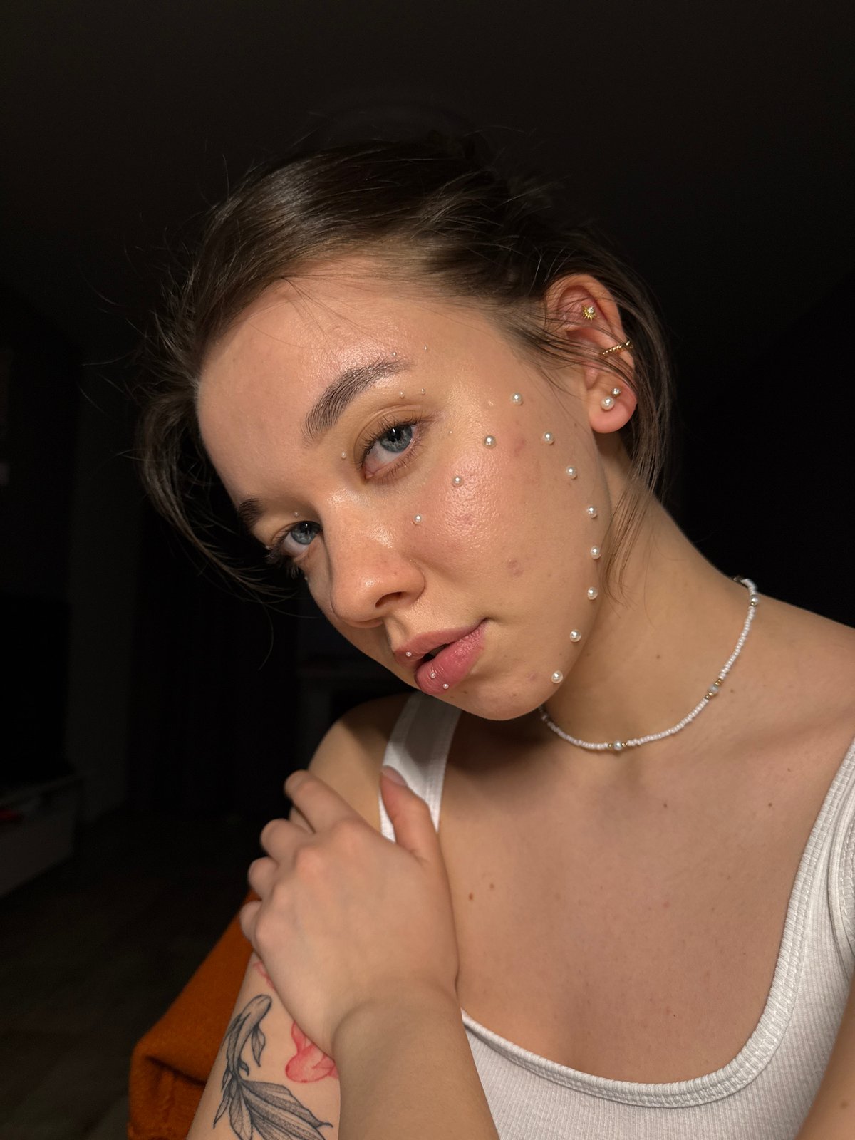 Woman with pearl face decoration observed in Noviy, Russia
