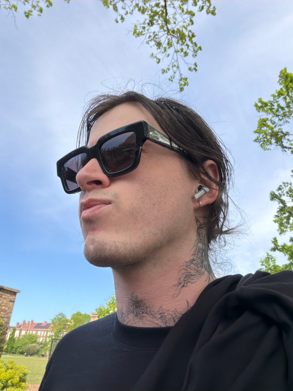 Person photographed in London park on sunny afternoon