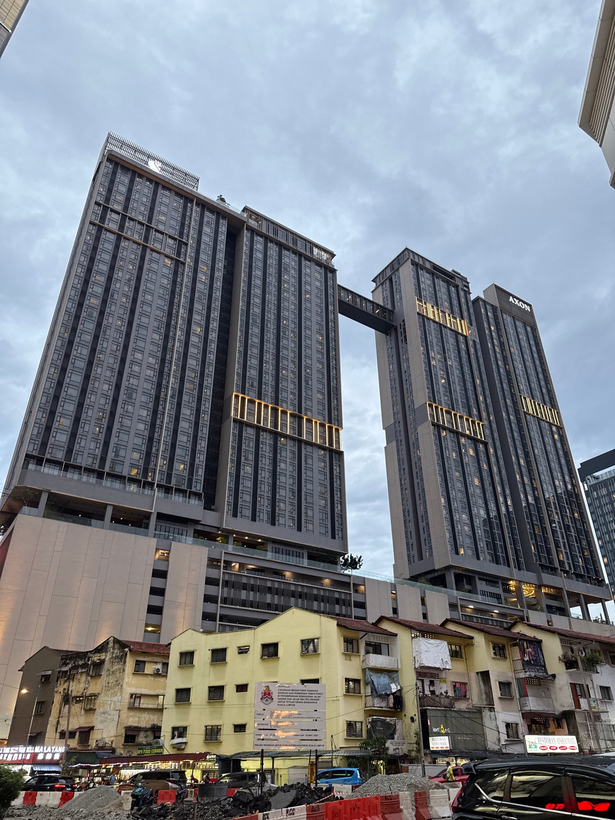 AXON-branded towers with sky bridge observed in Kuala Lumpur