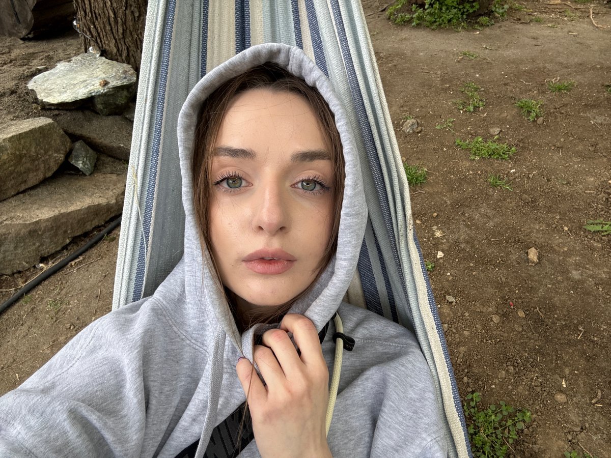 Young woman relaxes in hammock during outdoor break in Serbia