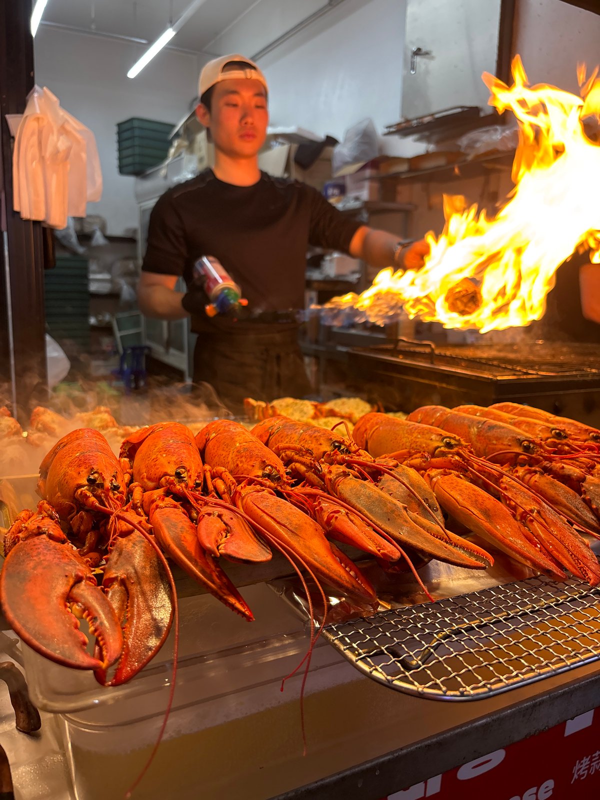 Busy street food market scene in Seogwipo-si, Jeju Island