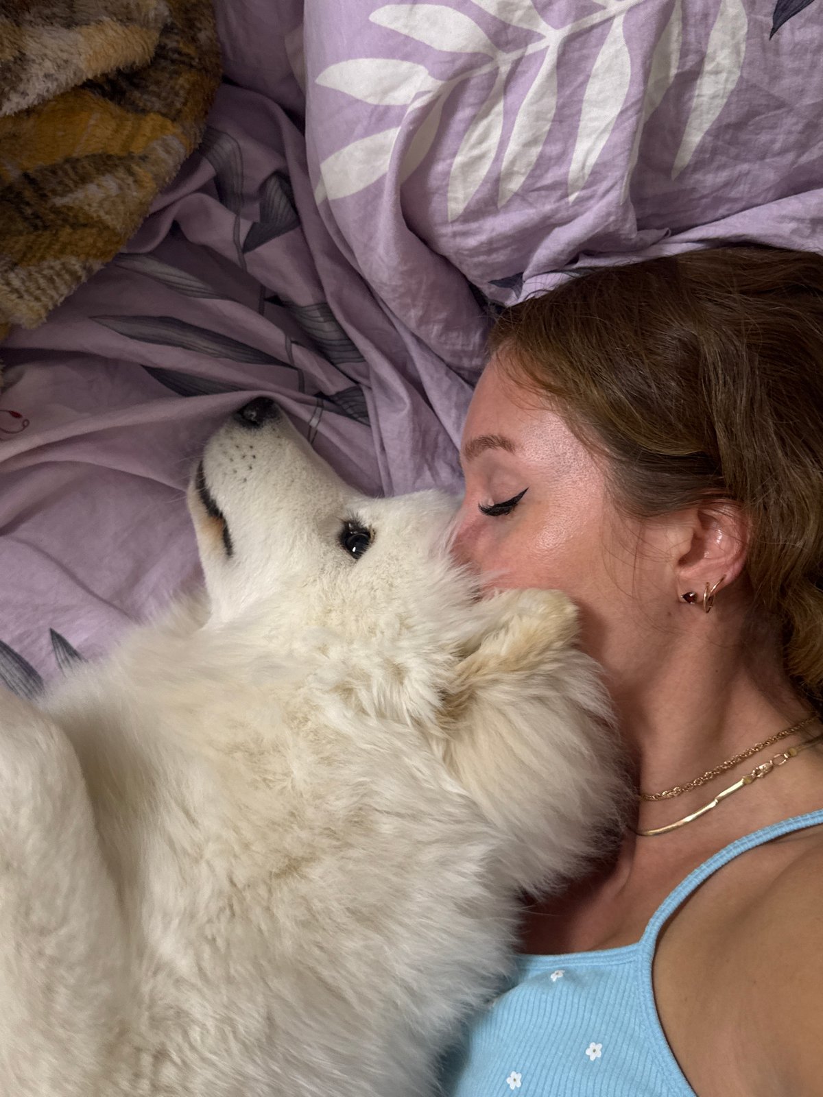 Woman shares tender moments with Samoyed dog in Chaikovsky