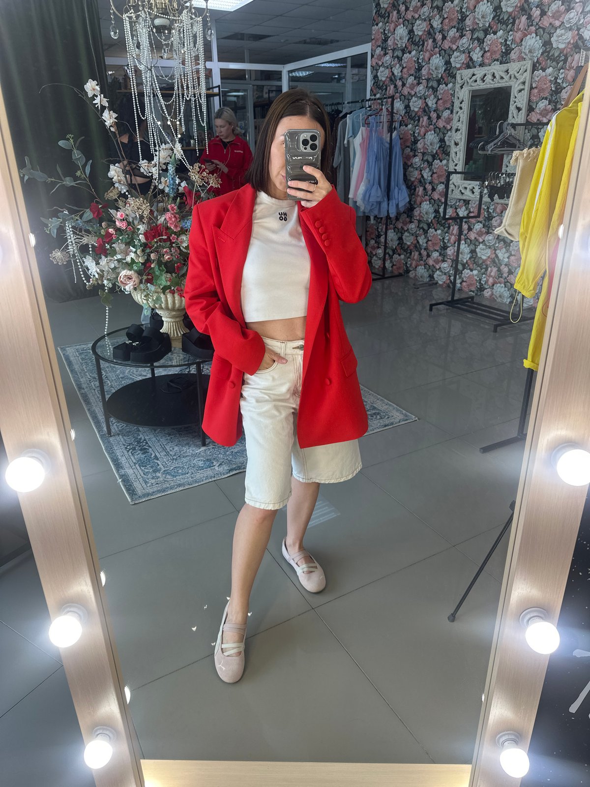 Woman takes mirror selfies in Votkinsk boutique