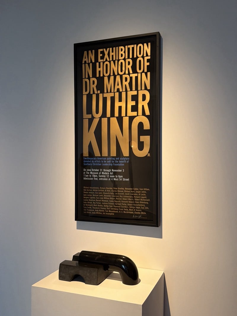 Museum visitor documents sculptures in New York gallery