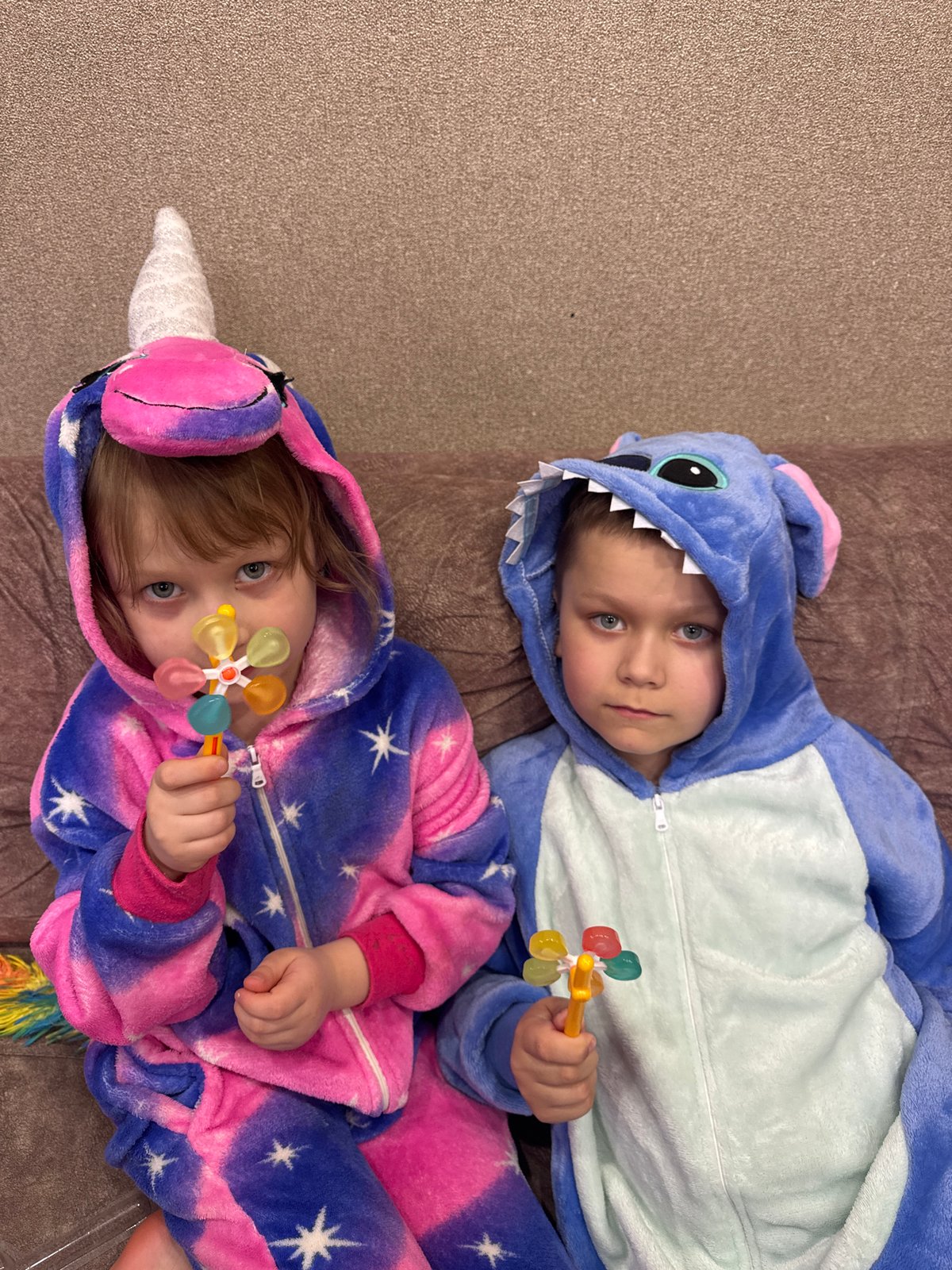 Children rest indoors in Stitch costume, Chaikovsky Russia