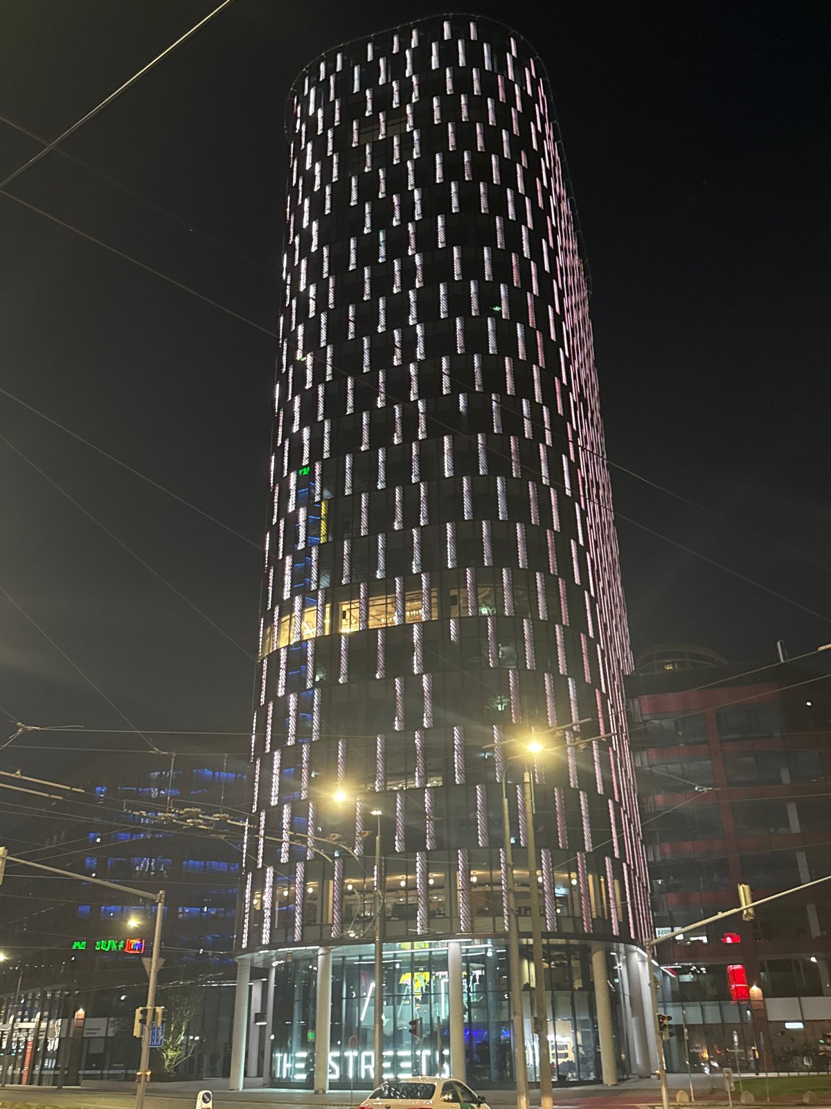 Evening tour of illuminated Bratislava towers and street scenes