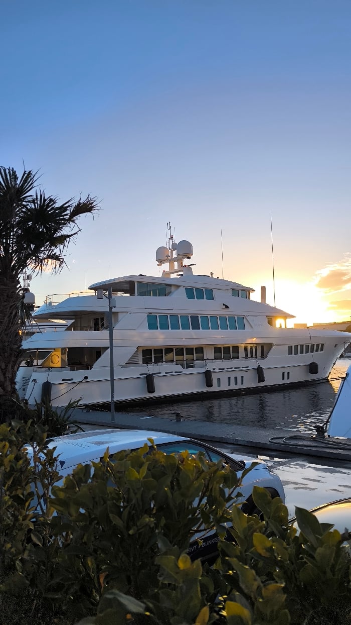 Barcelona marina sunset draws evening strollers and yacht watchers