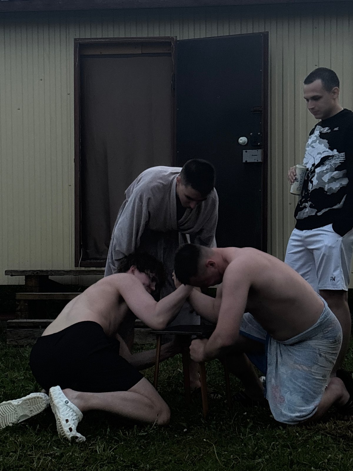 Four people gather for outdoor social activities in Пальники