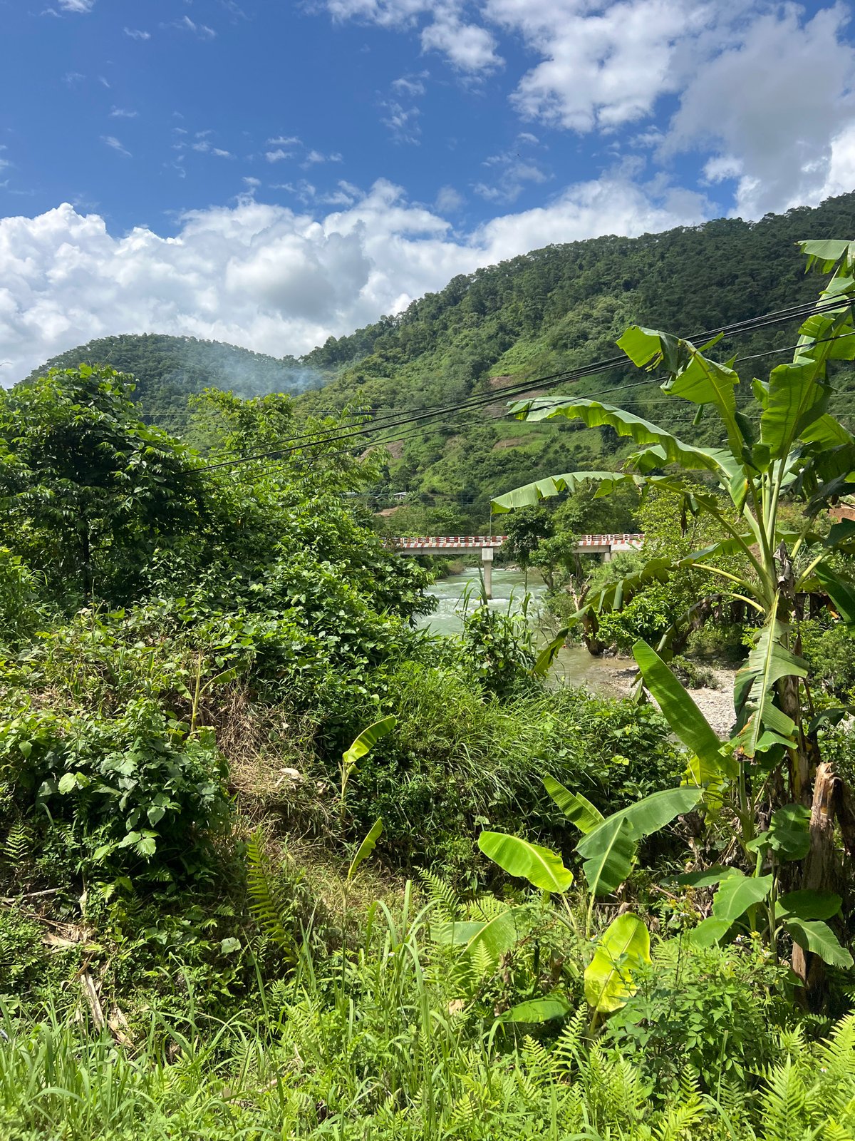 Tropical hillside and river scene in Thuận Hòa Commune, Vietnam