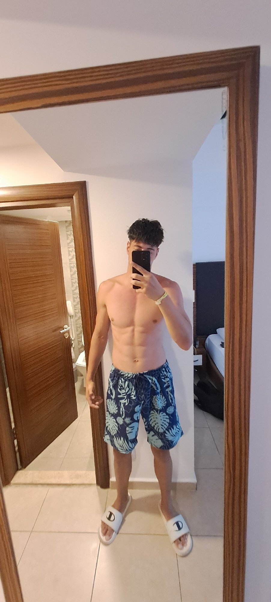 Young man takes multiple mirror selfies in Kuşadası facility