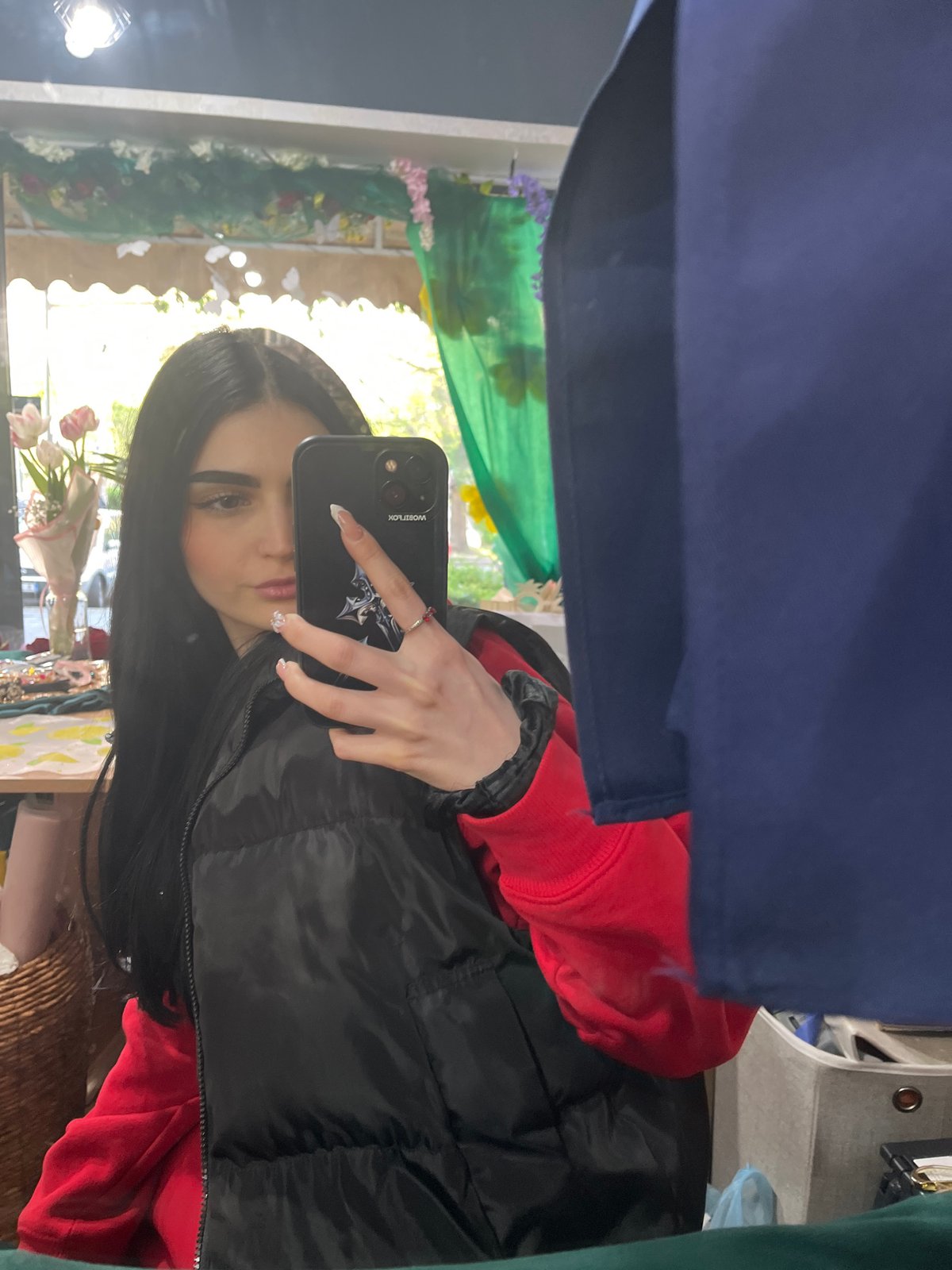Woman documents afternoon stroll through Burgas with selfies, flowers