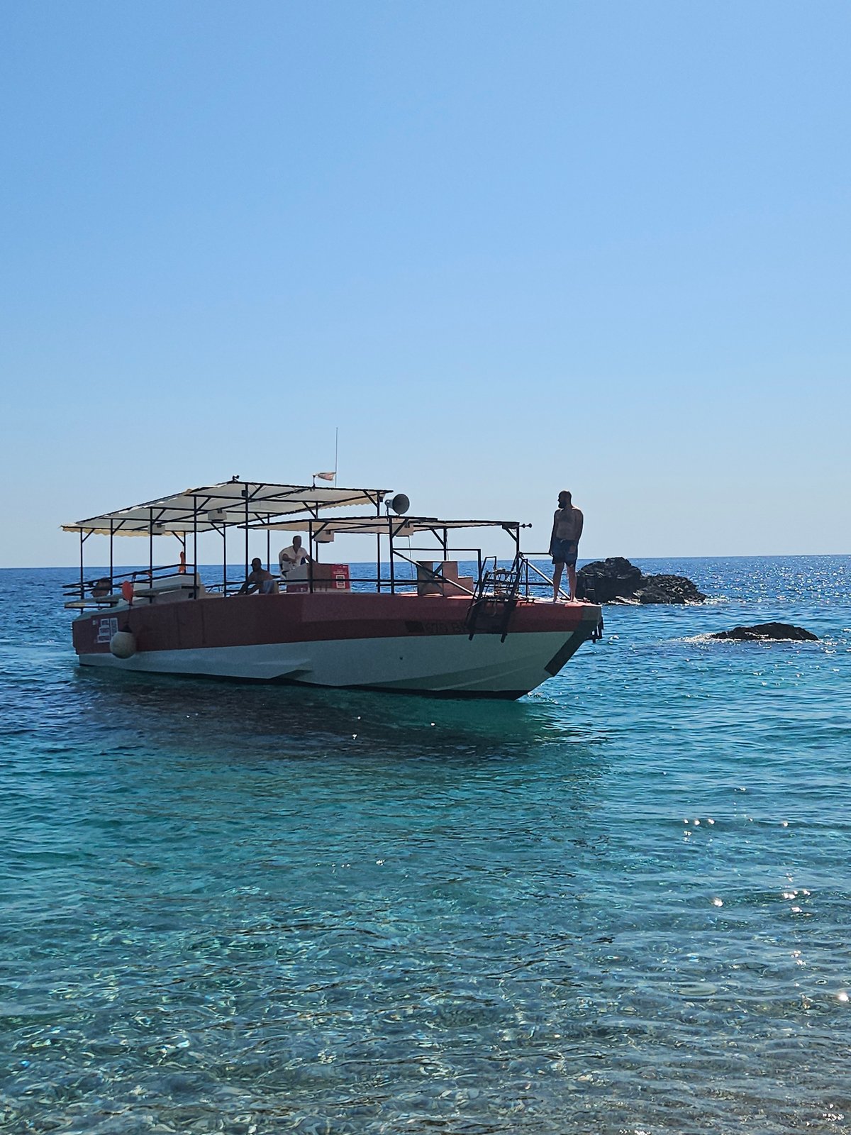 Lazy summer afternoon on the Montenegro coast by boat and beach