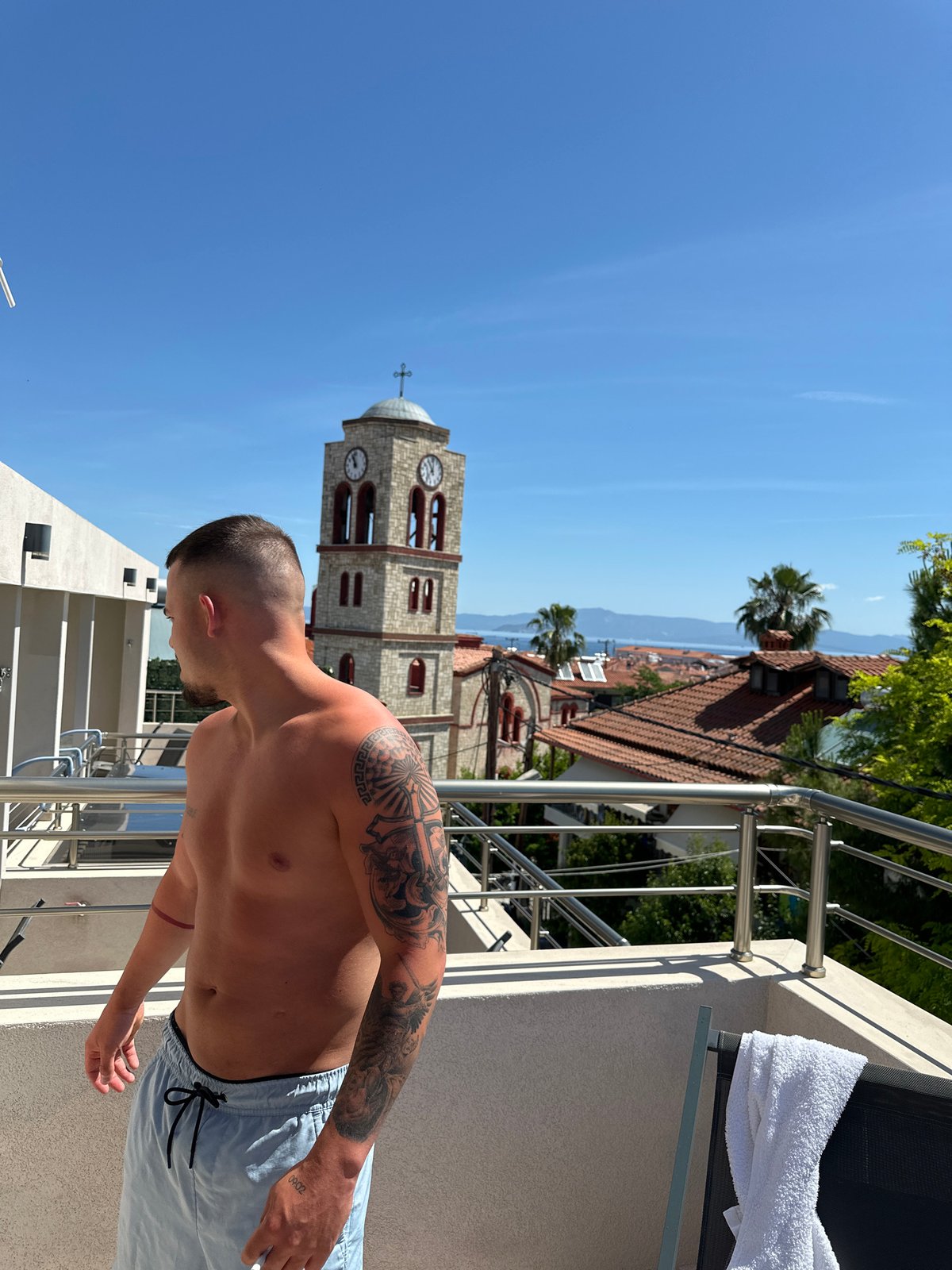 Man spotted on balcony in Pallini, Greece morning scene