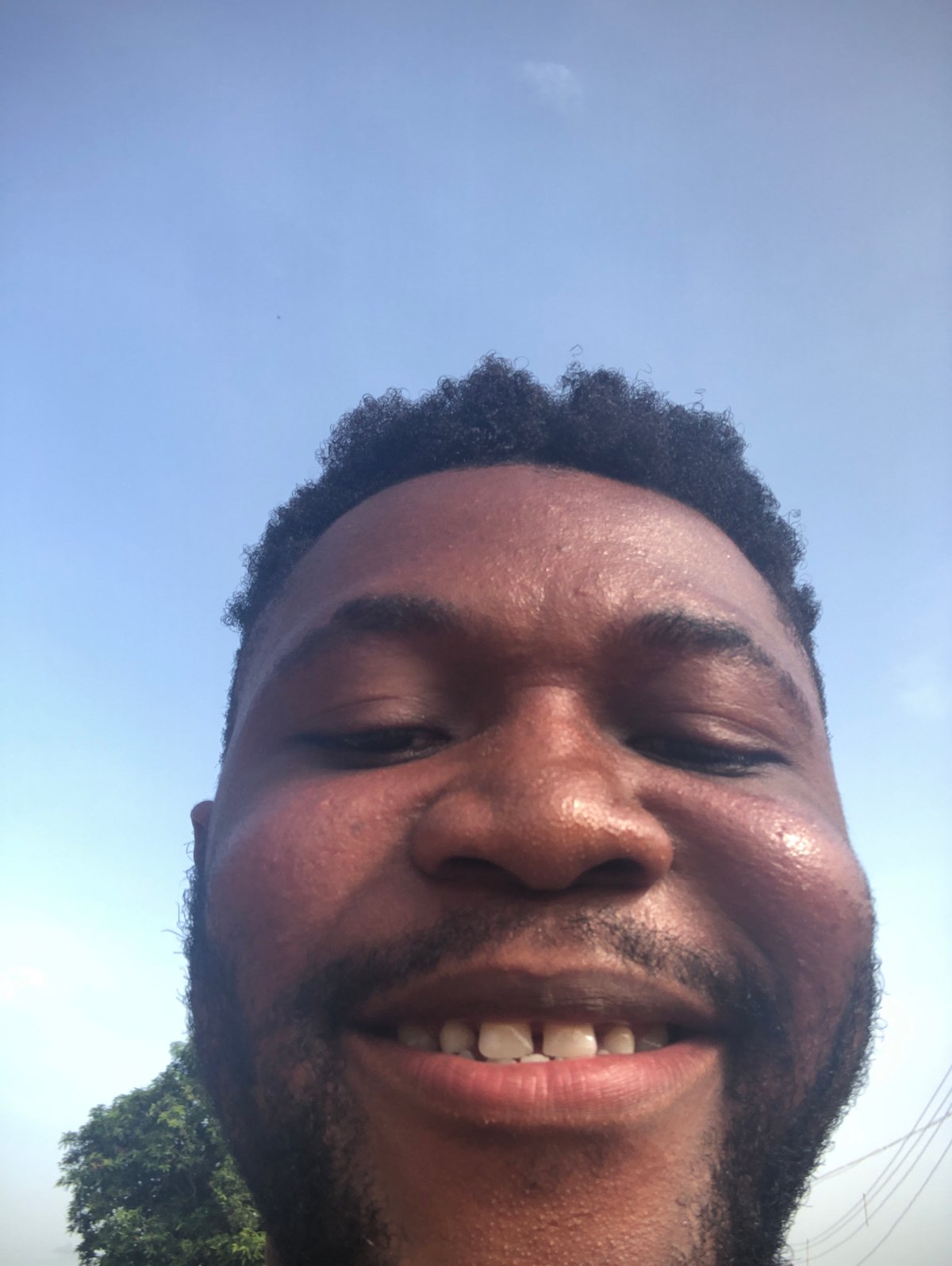Man photographed smiling in multiple shots at unknown location