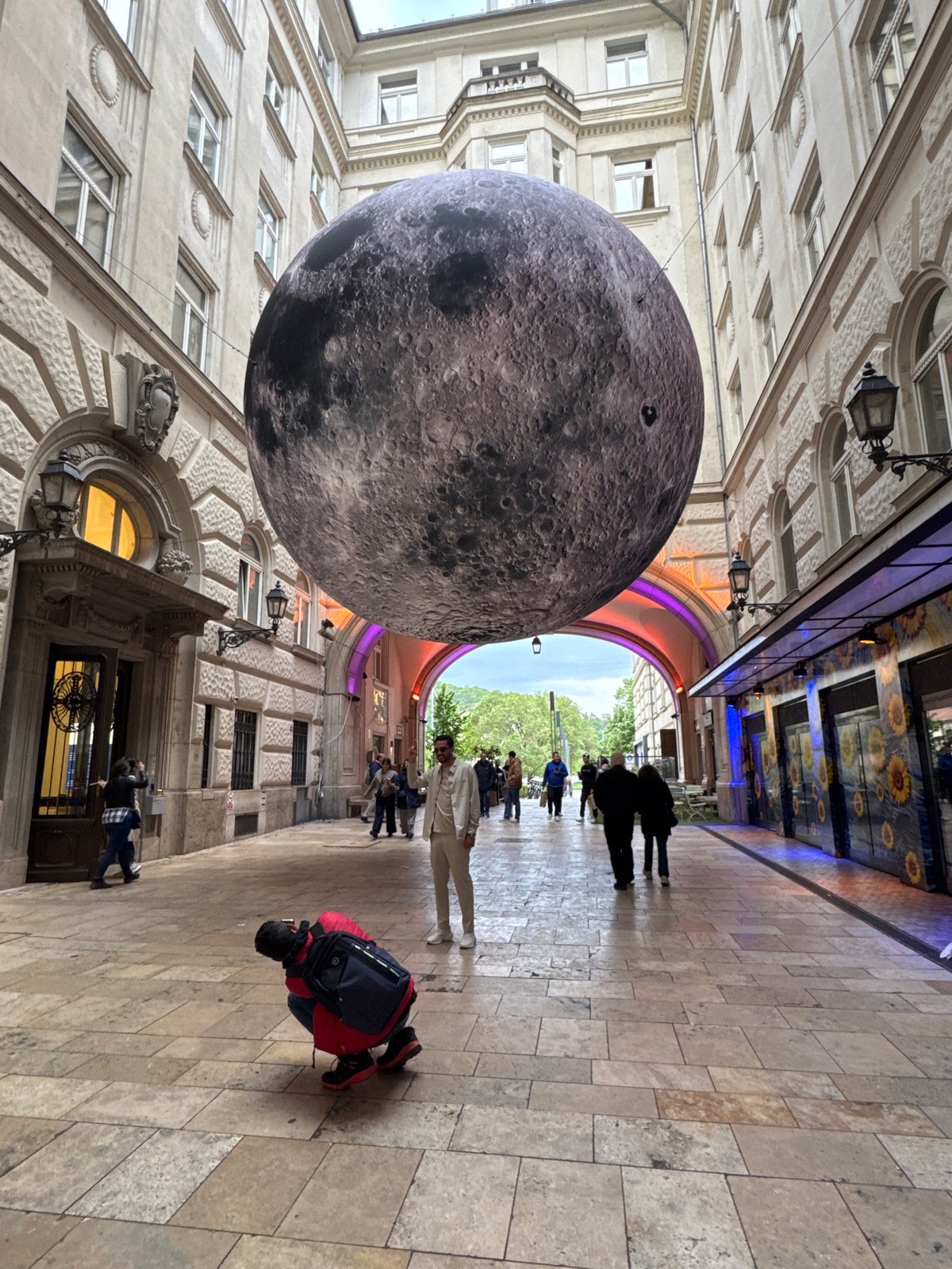 Giant inflatable moon art installation draws crowds in Budapest