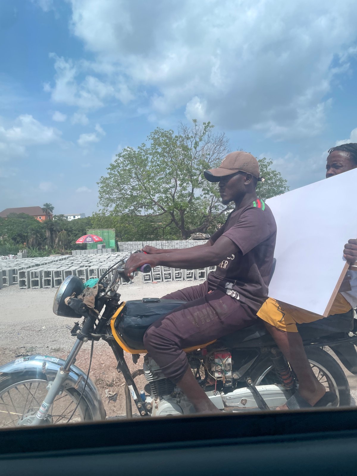 Casual daily life documented across Abuja neighborhoods during afternoon