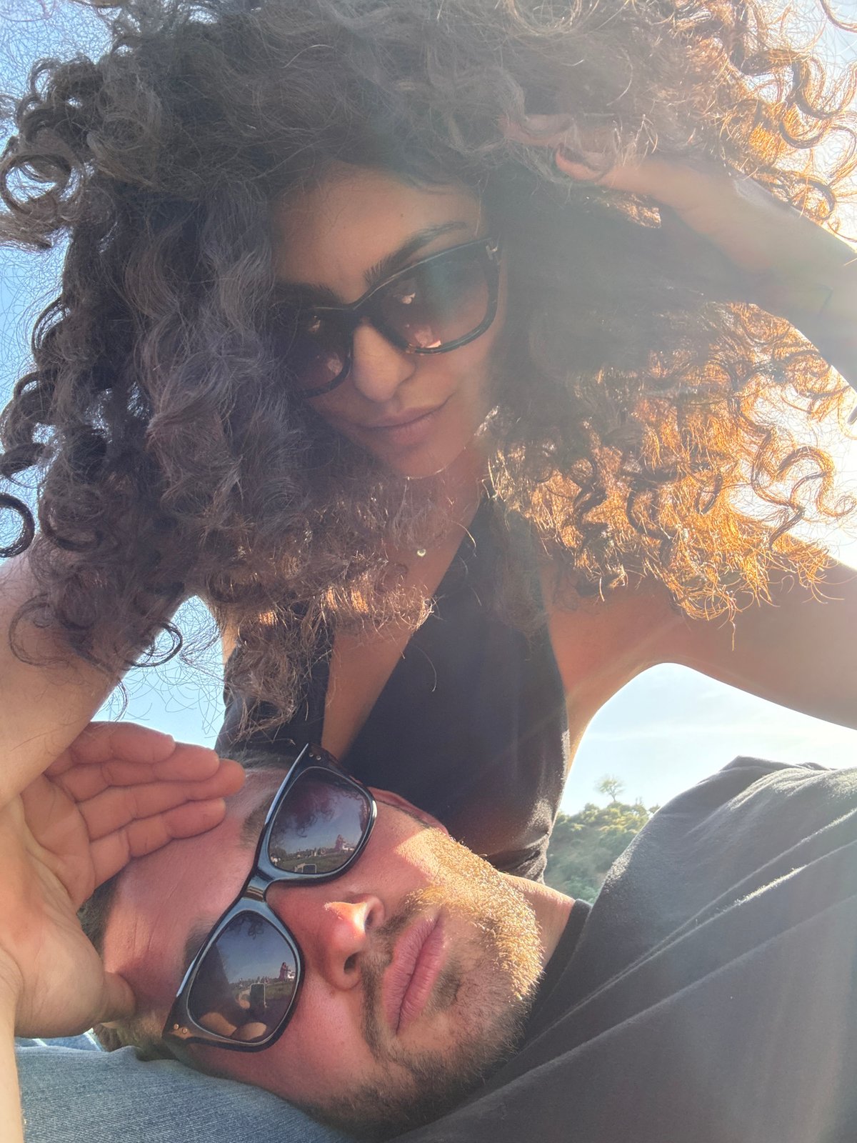 Two people pose for outdoor selfie in Los Angeles