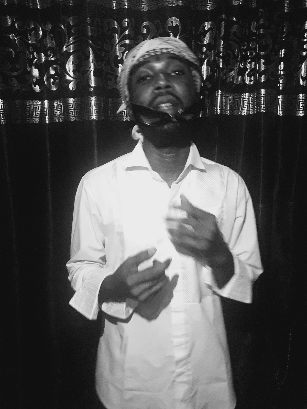 Man in traditional Middle Eastern dress photographed in Lokoja