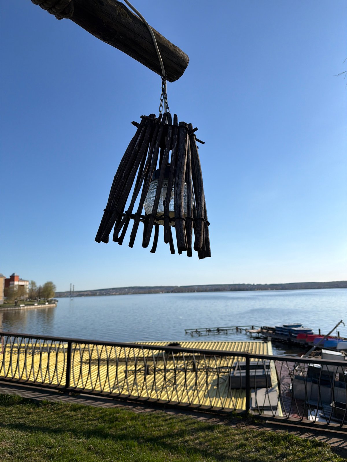 Wooden lamp observed at Votkinsk Reservoir waterfront pier