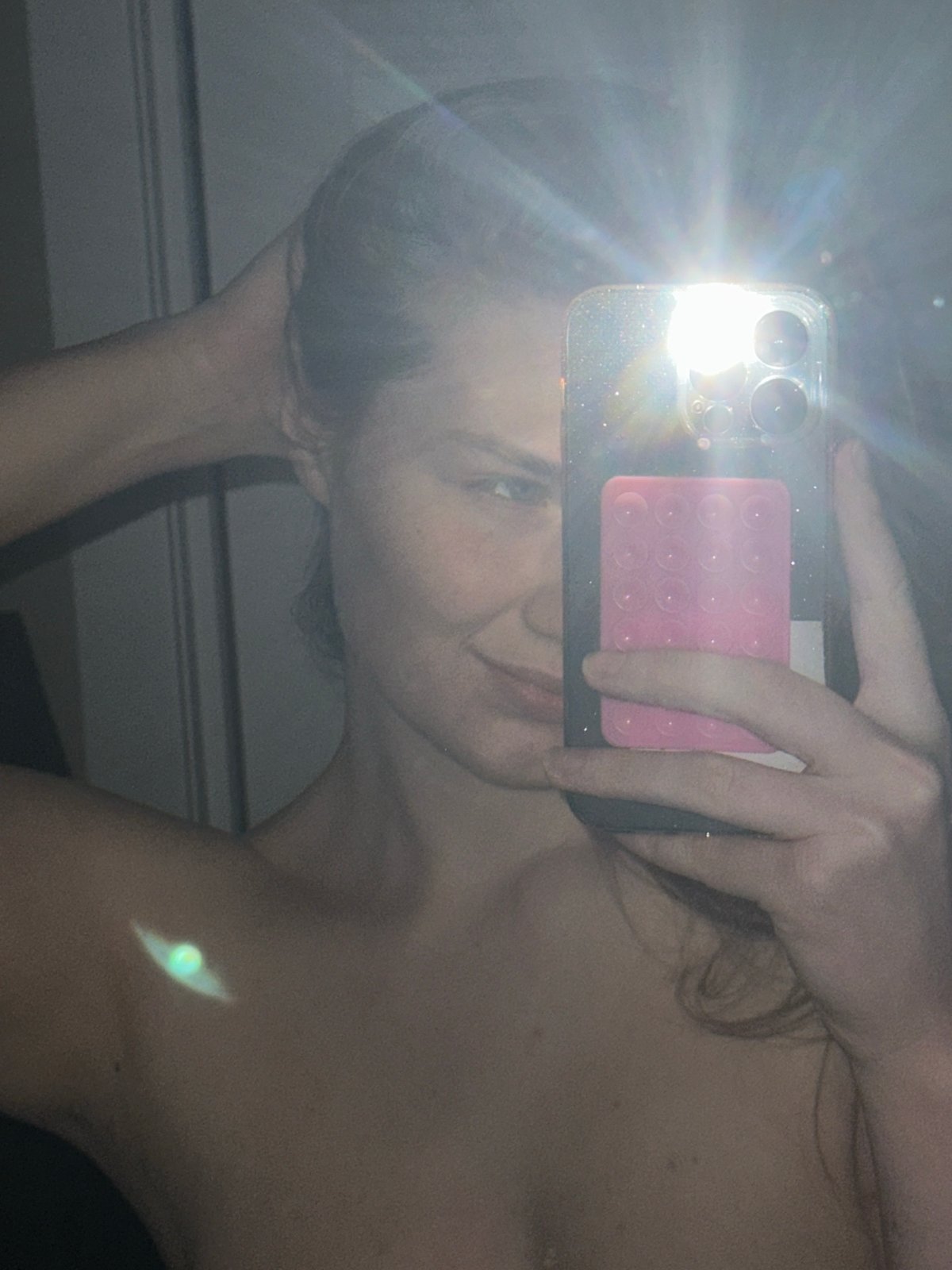 Mirror selfie taken in Kazan obscured by camera flash